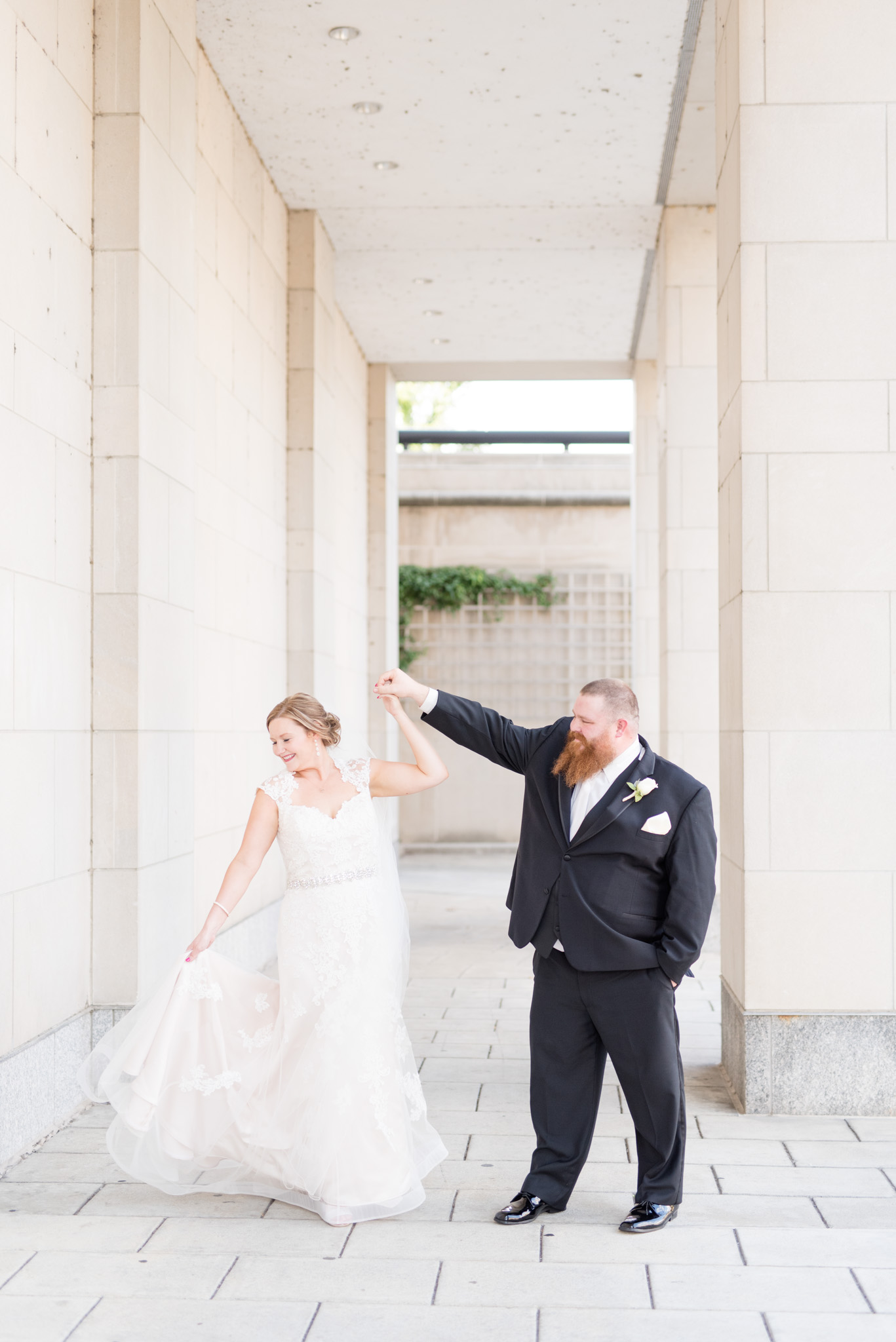 Bride is twirled by groom during luxury downtown Indianapolis wedding.