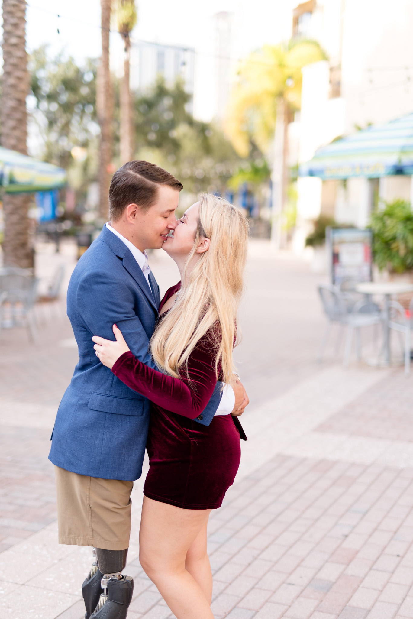 Engaged couple kiss in downtown St. Petersburg