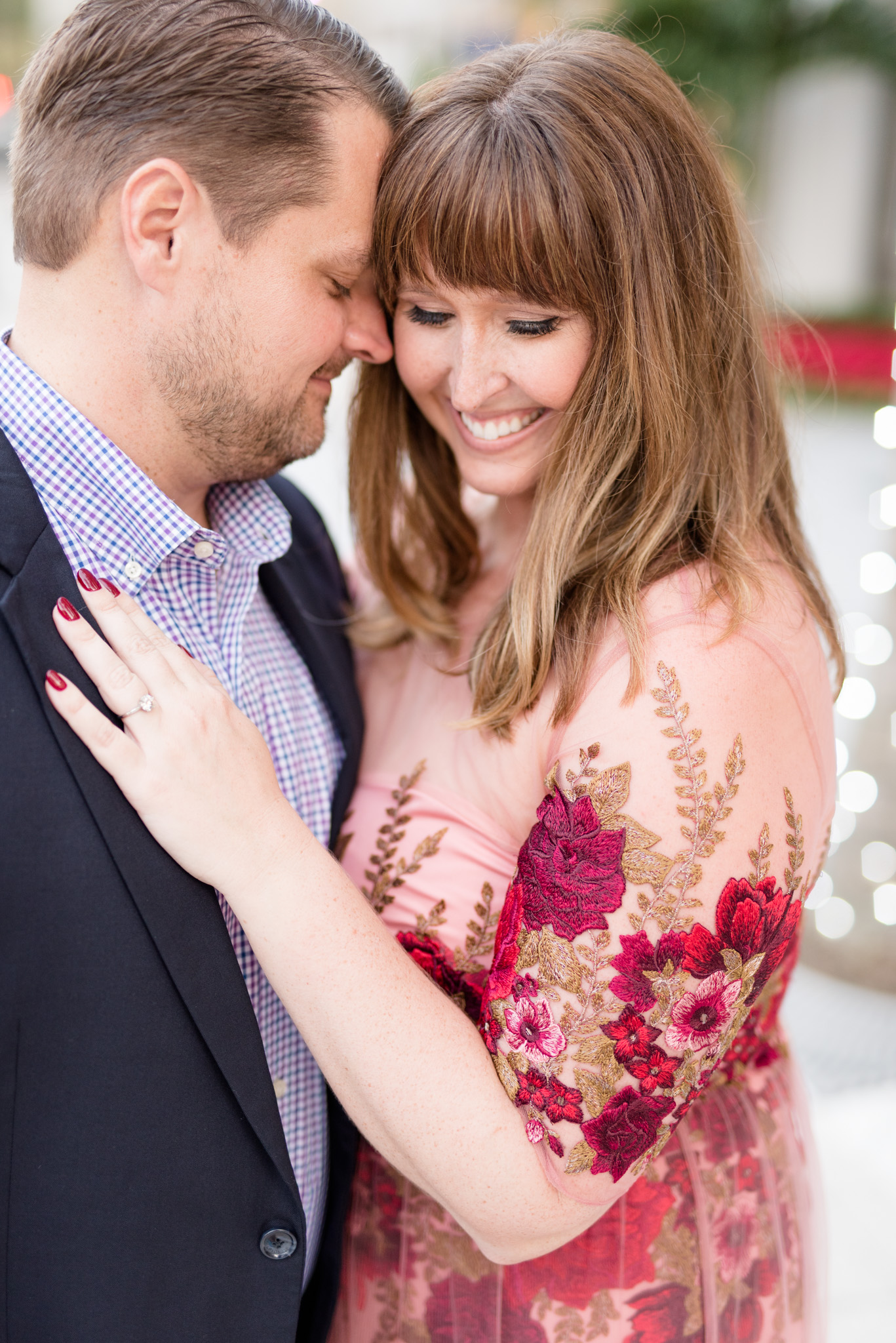 Engaged Couple cuddles in downtown setting