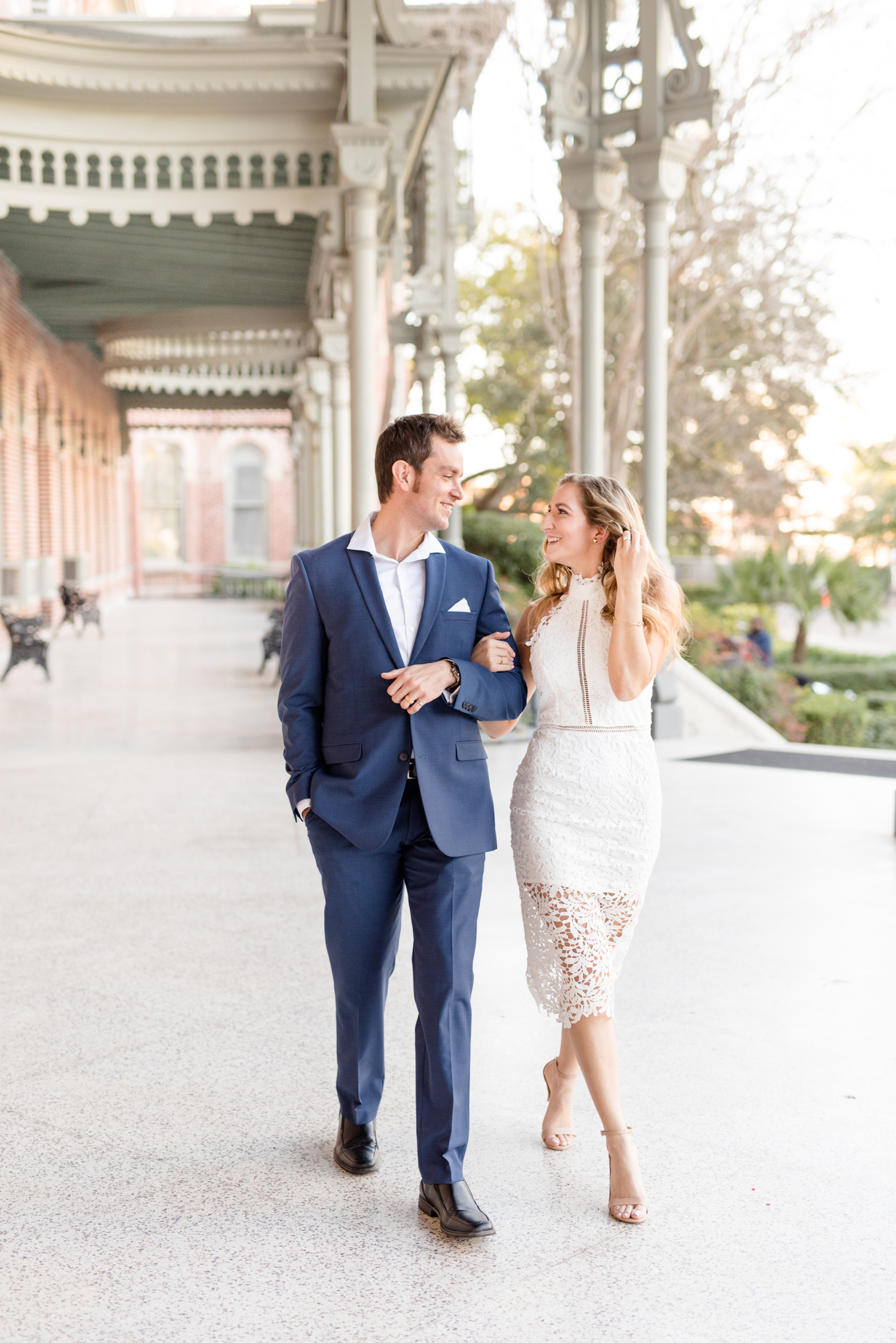 Couple walks on patio at University of Tampa.