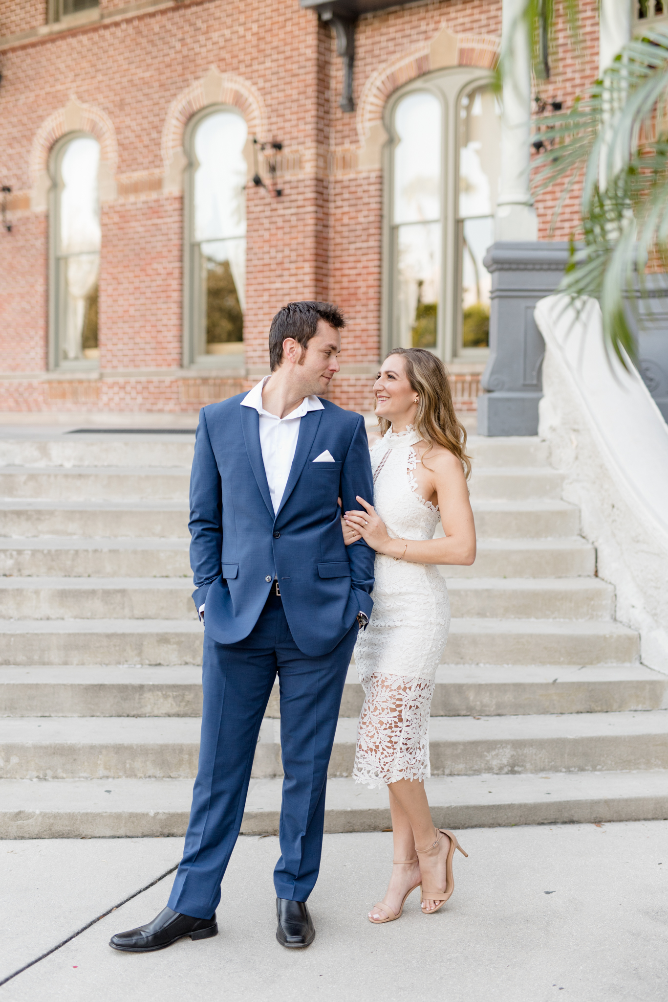 Couple looks at each other and laughs.