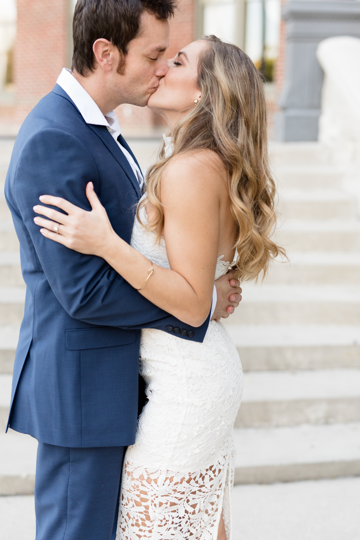 Couple kisses during engagement shoot.