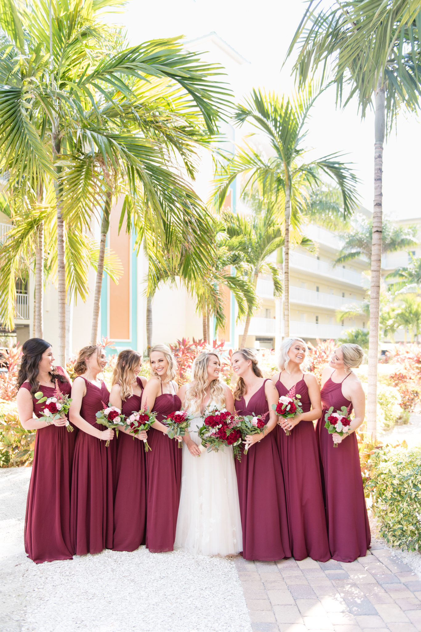 Bridal party laughs together.
