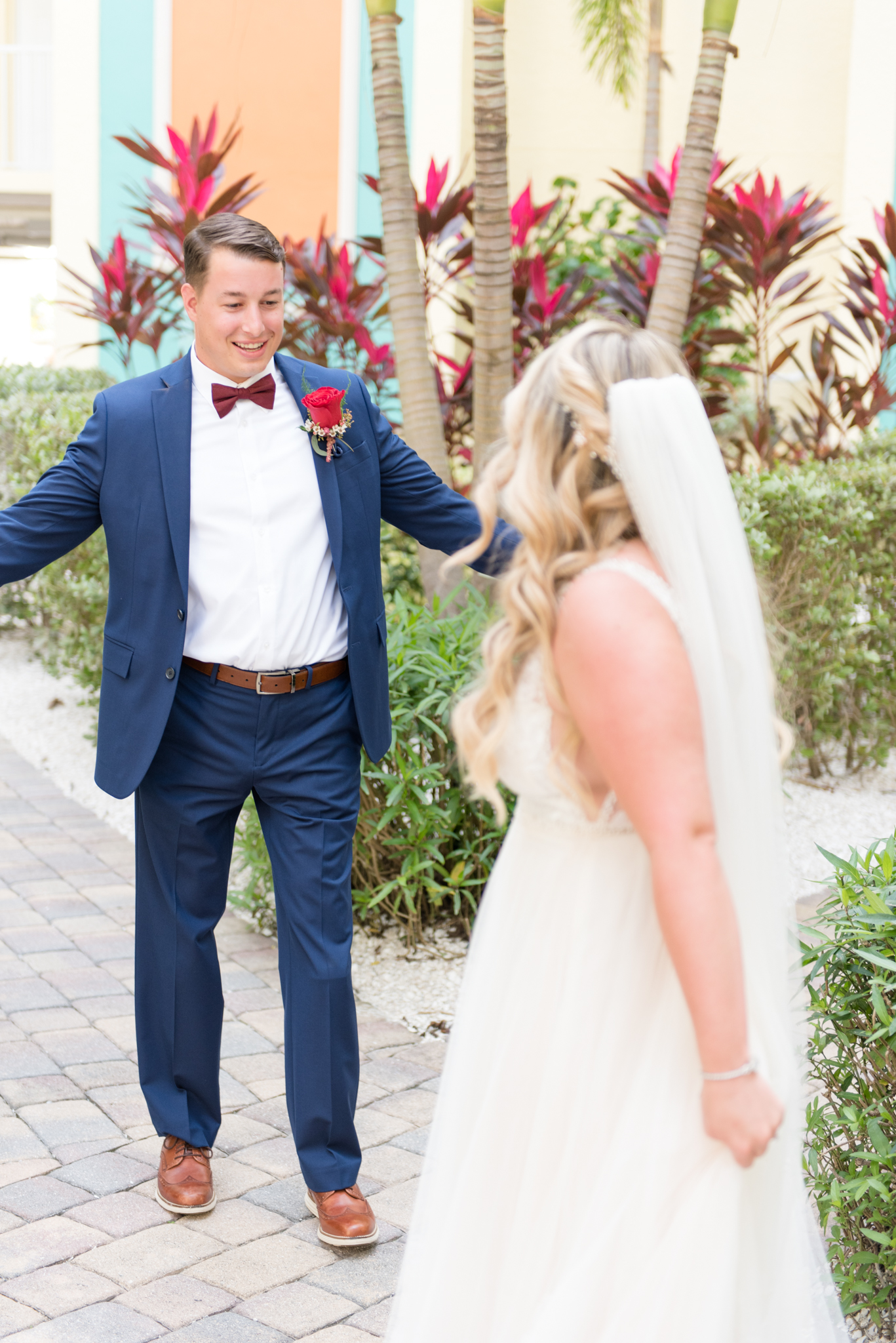 Groom smiles during first look.