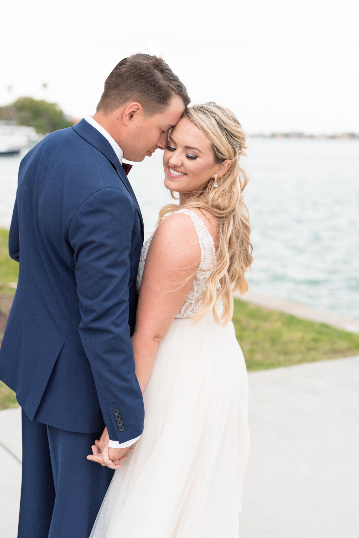 Bride and groom snuggle.