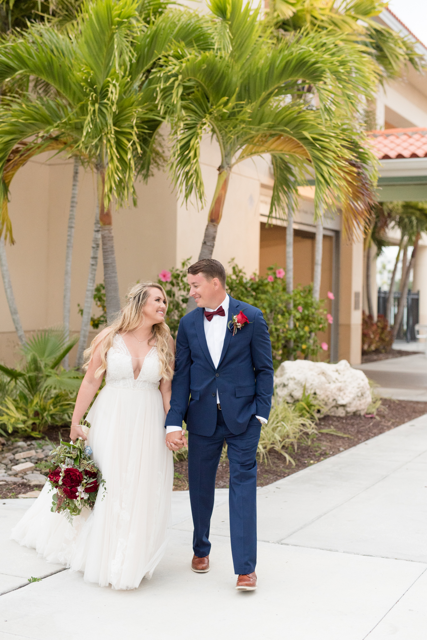 Bride and groom walk together.