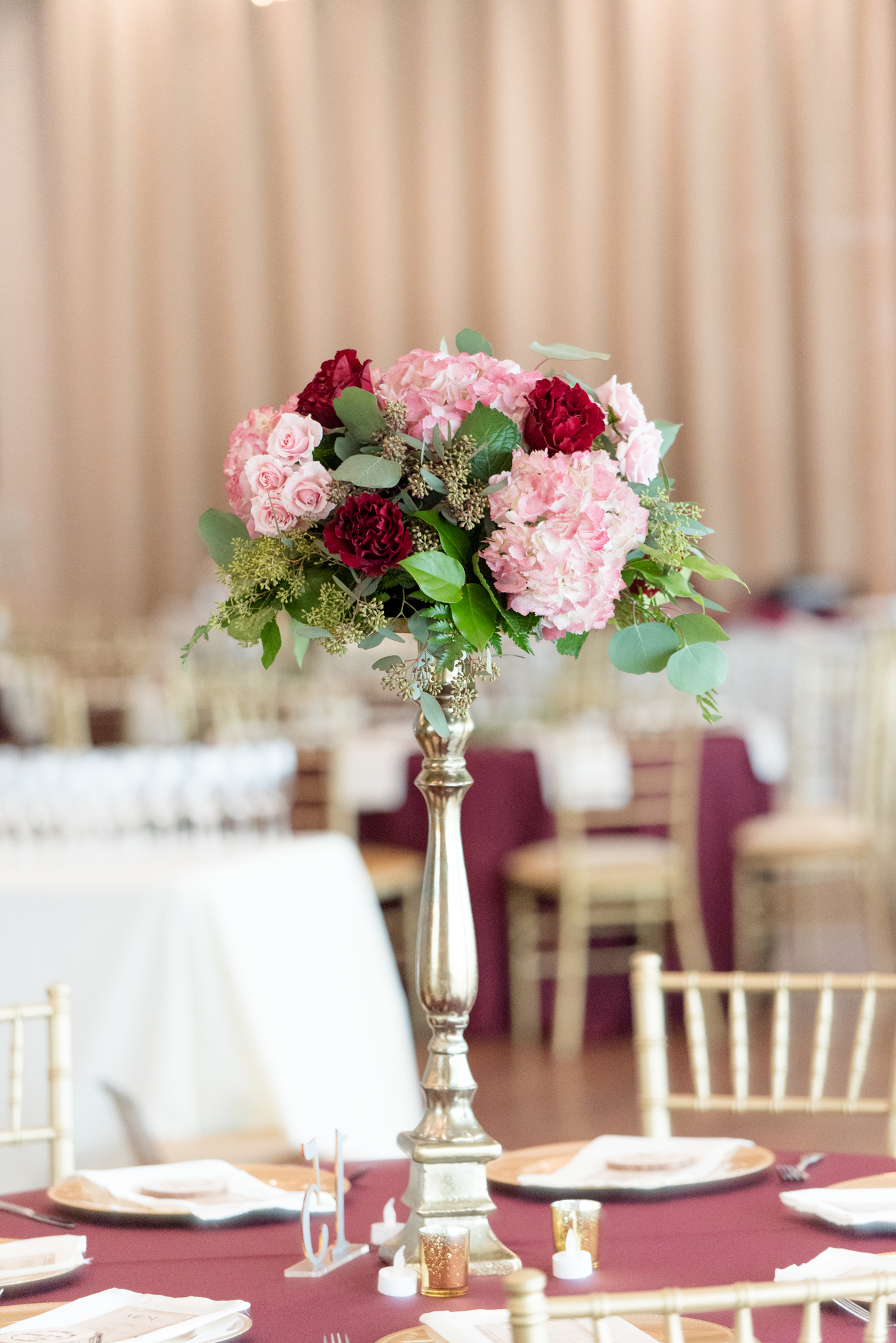 Close up of wedding reception floral centerpieces.