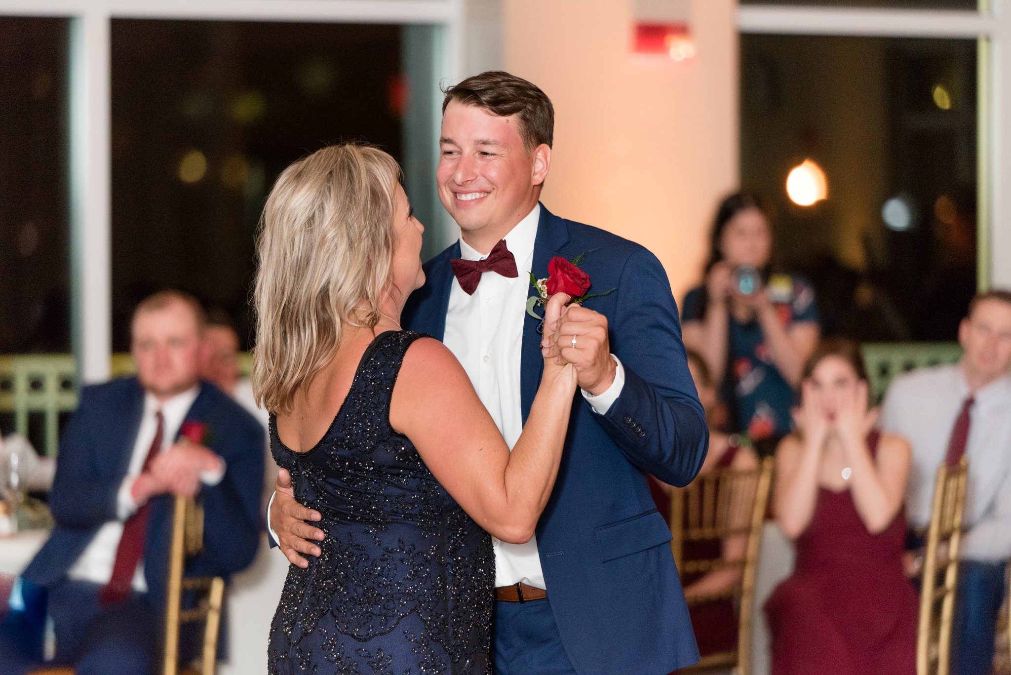 Groom dances with mother.