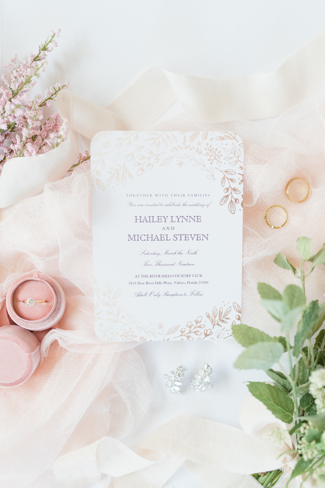 Wedding invitation and rings