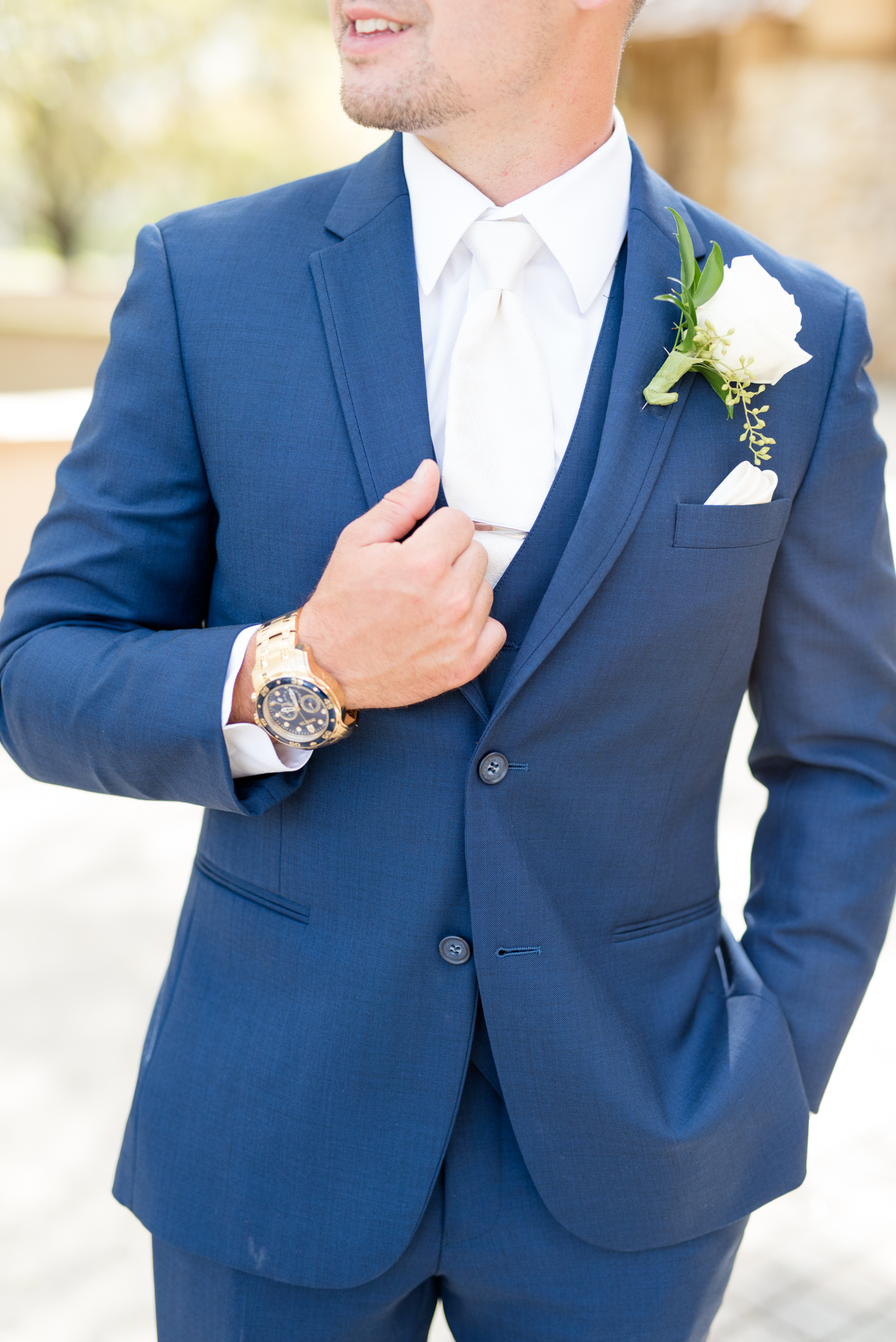 Closeup of groom's suit.