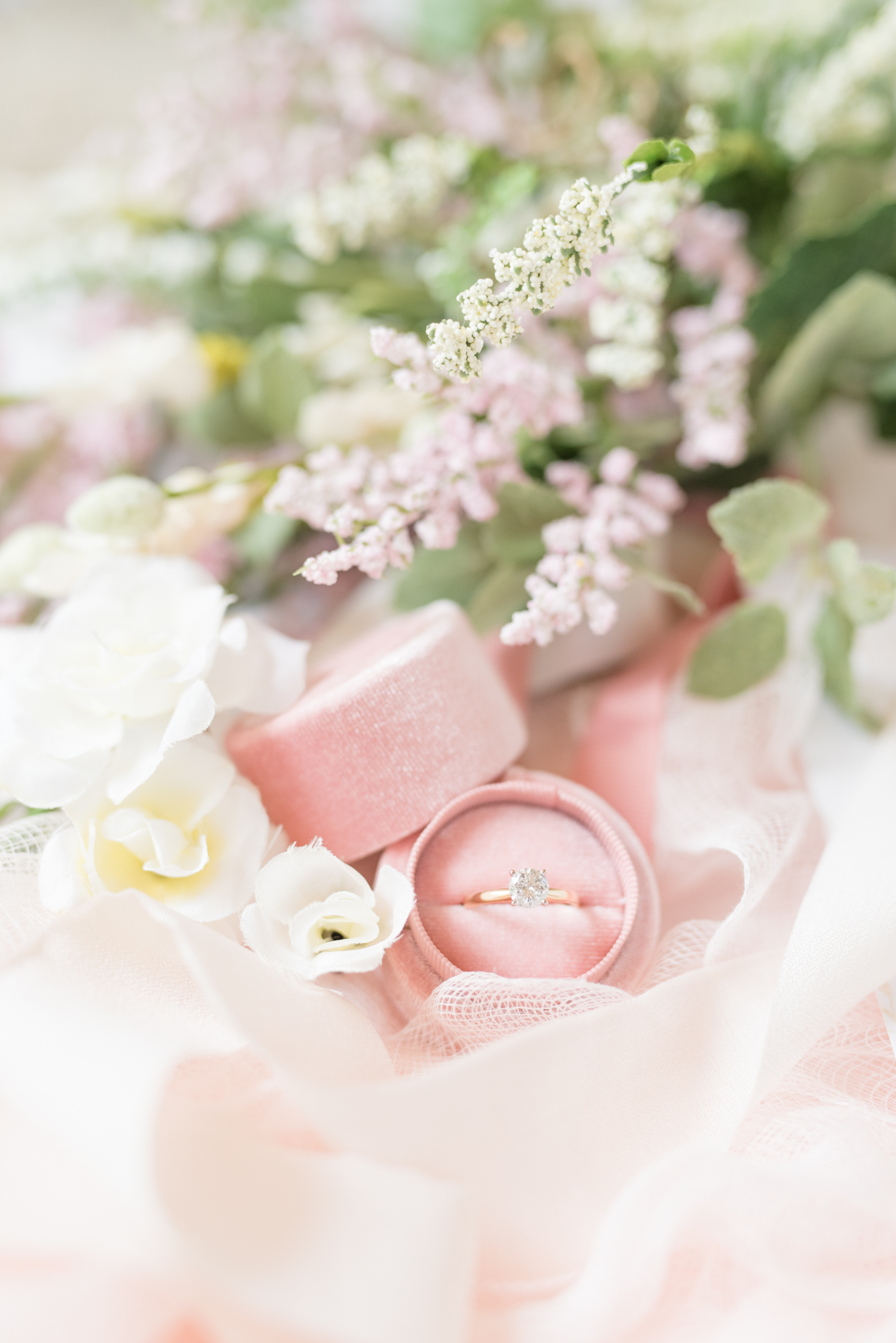 Engagement ring and wedding flowers.