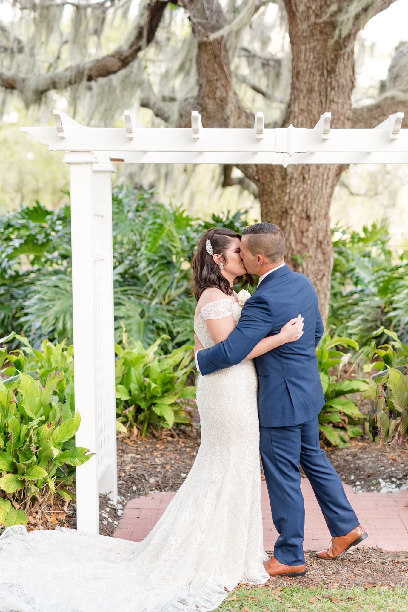 Bride and groom kiss at ceremony.