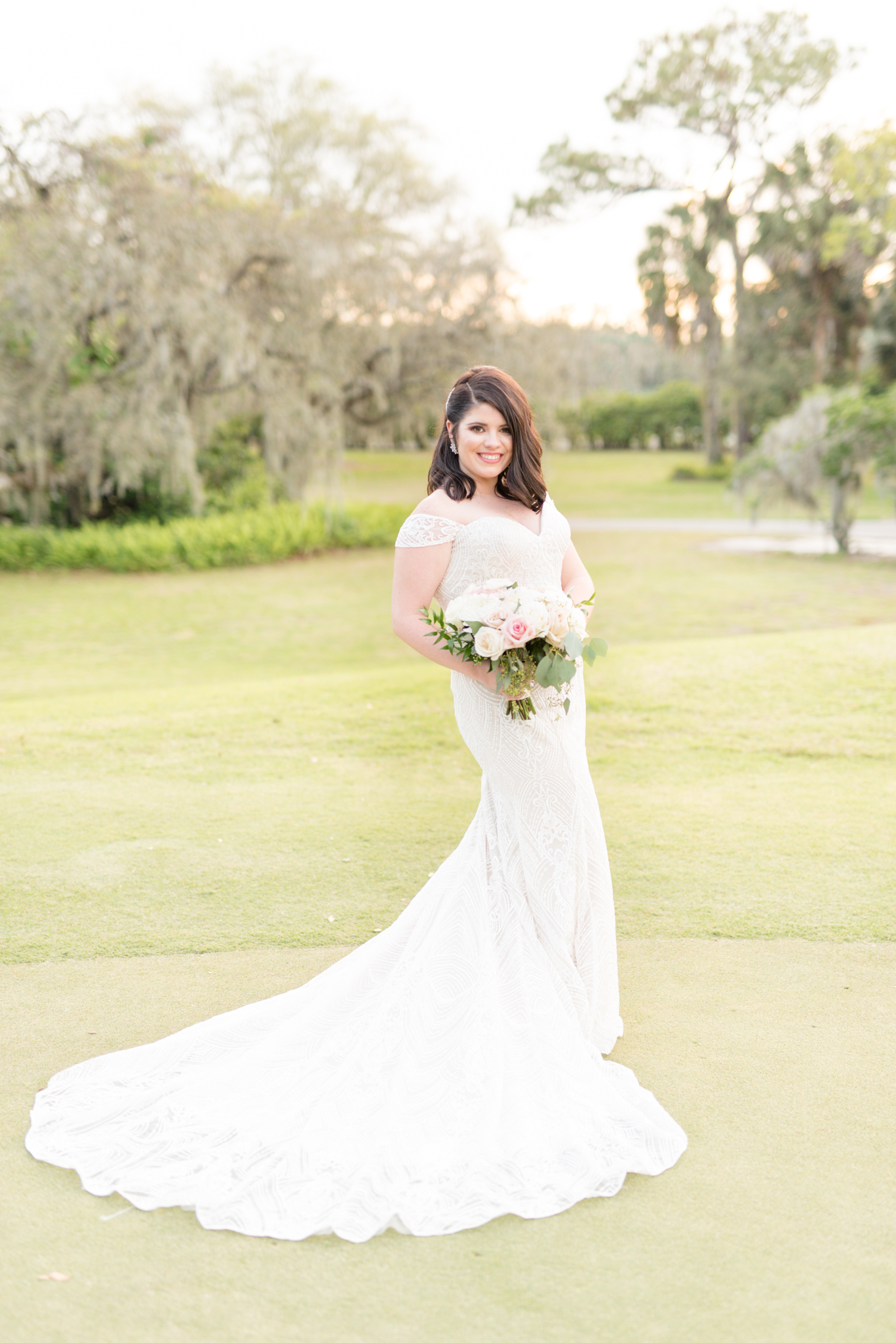 Bride smiles during sunset.