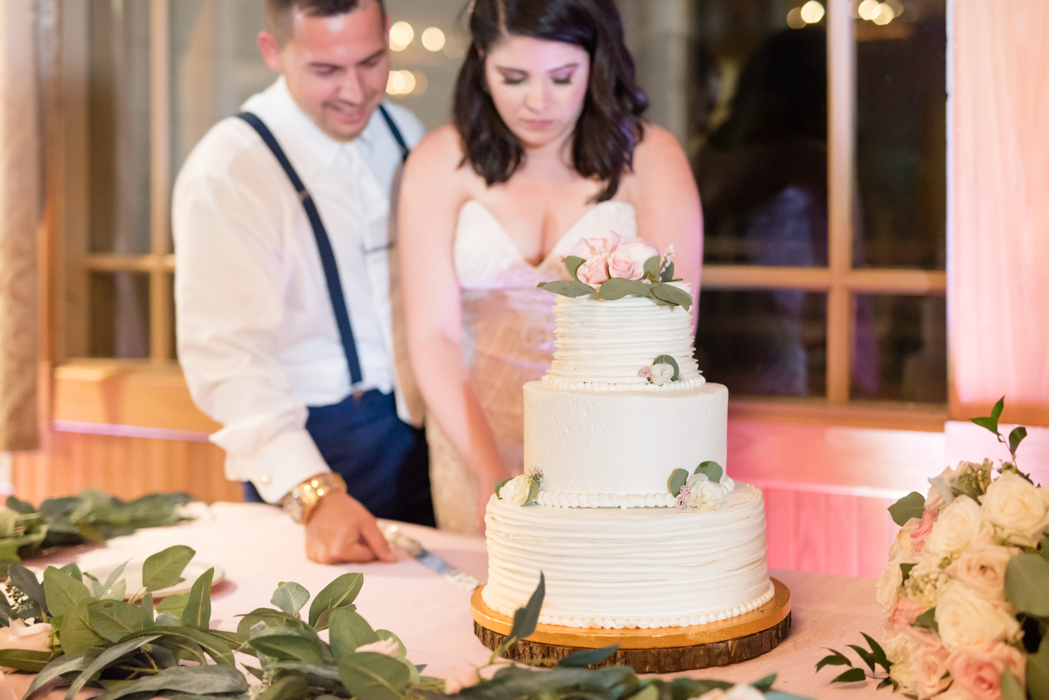 Cake cutting at wedding.