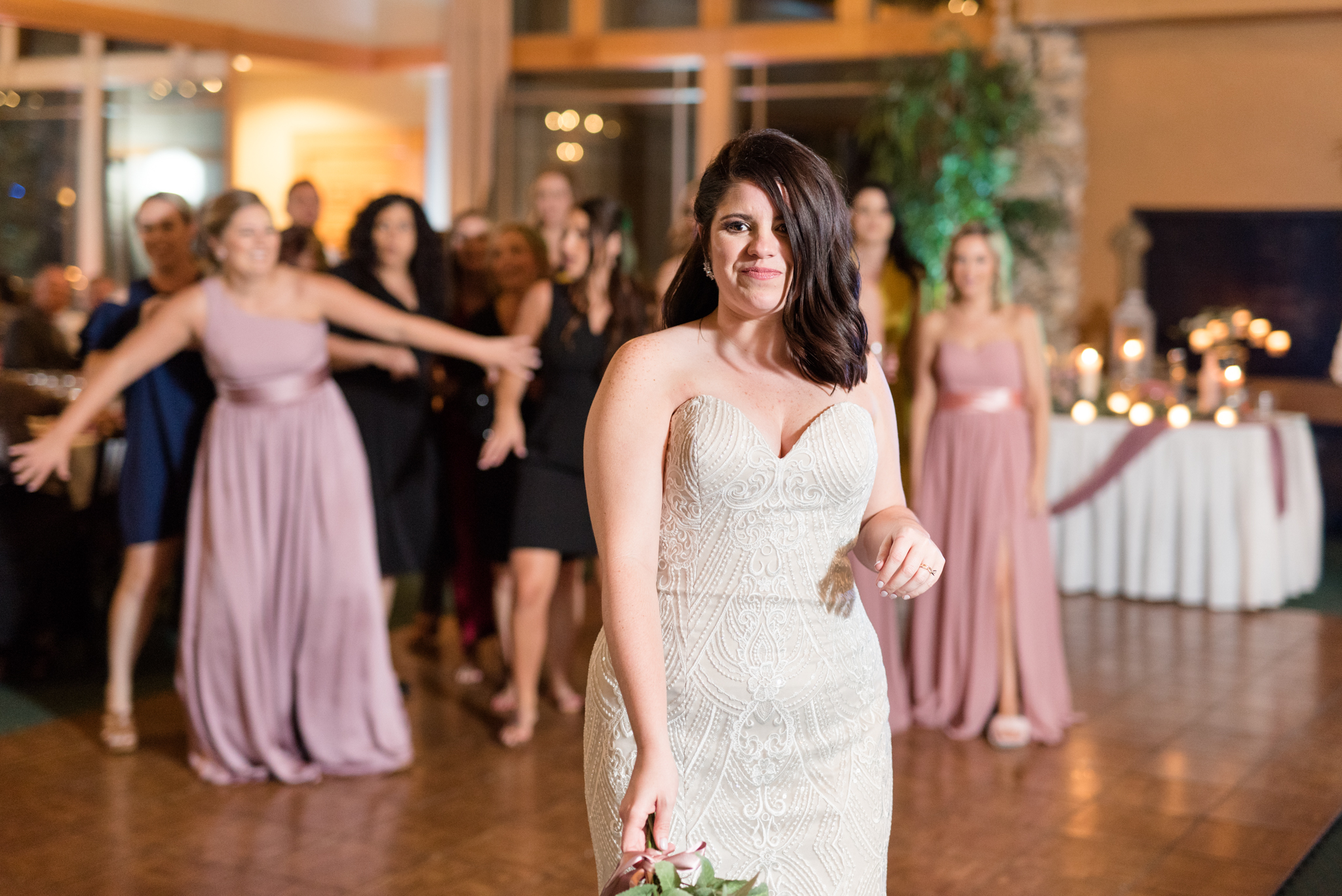 Bride gets ready to throw bouquet.