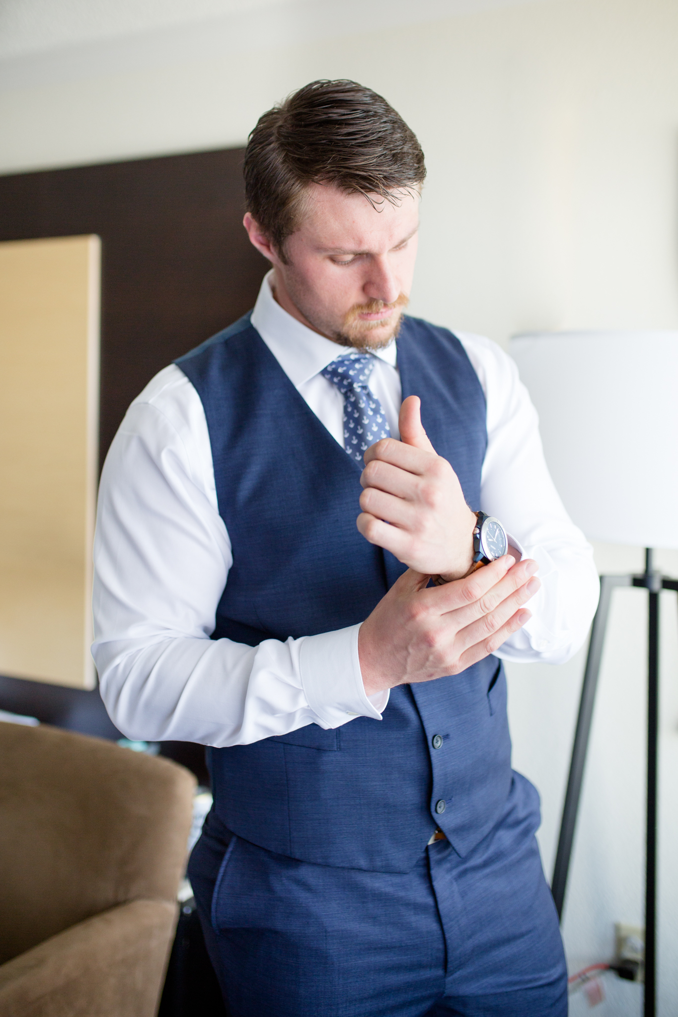 Groom puts on watch.