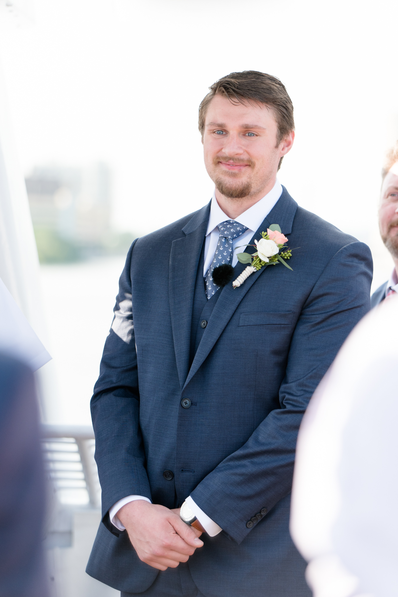 Groom looks at bride during ceremony.