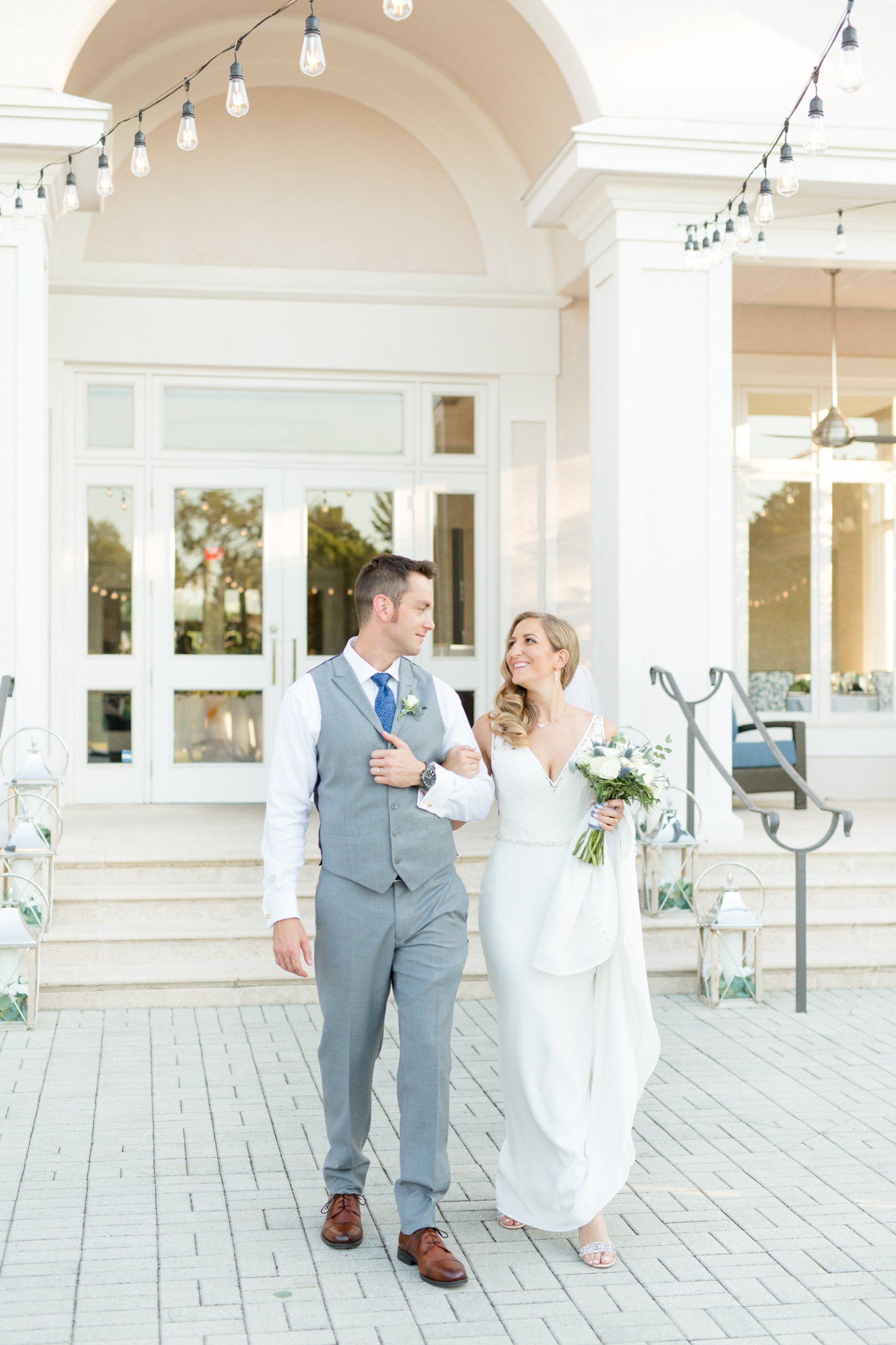 Bride and groom walk together at Rosedale Gold and Country Club.