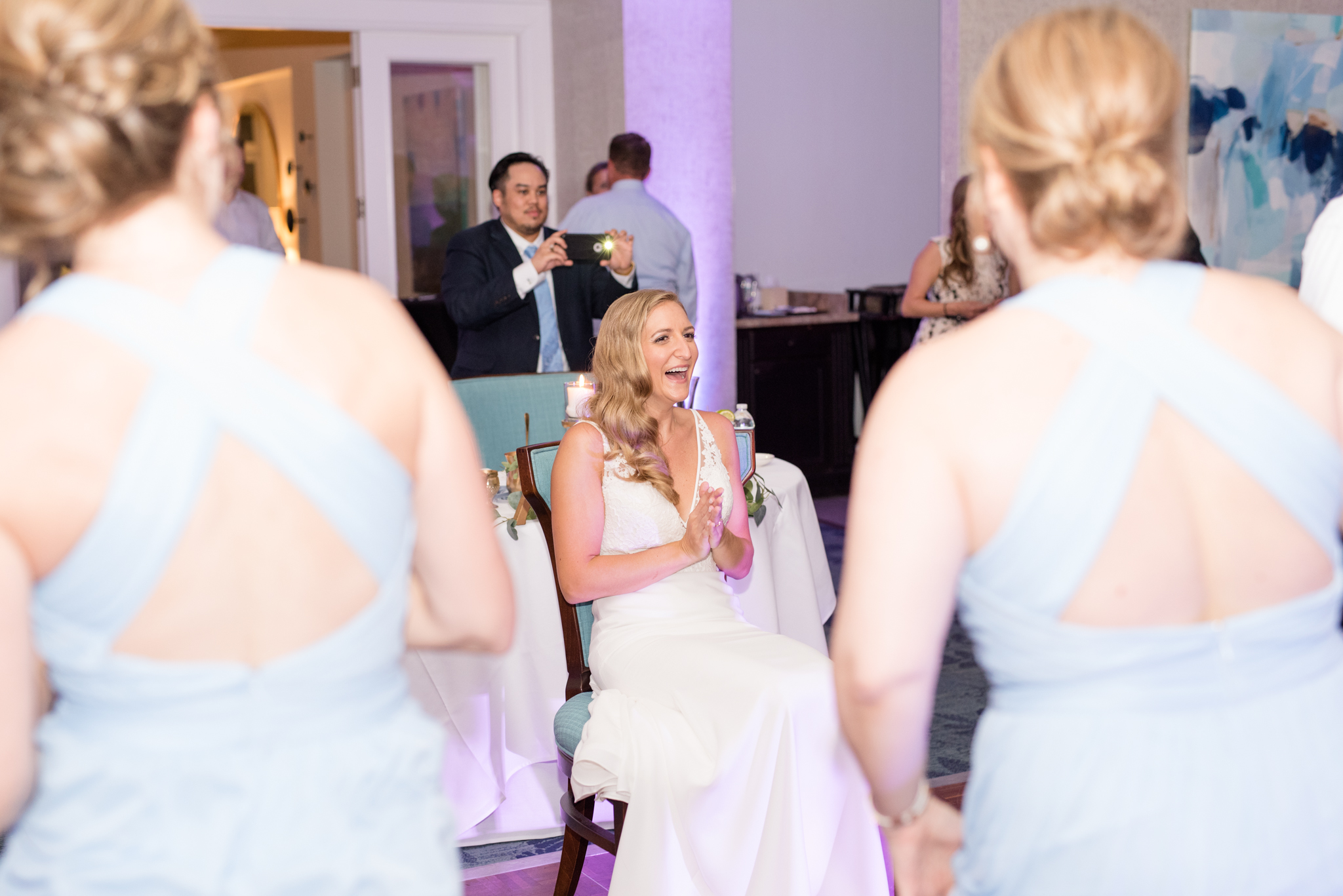 Bride laughs at choreographed dance.