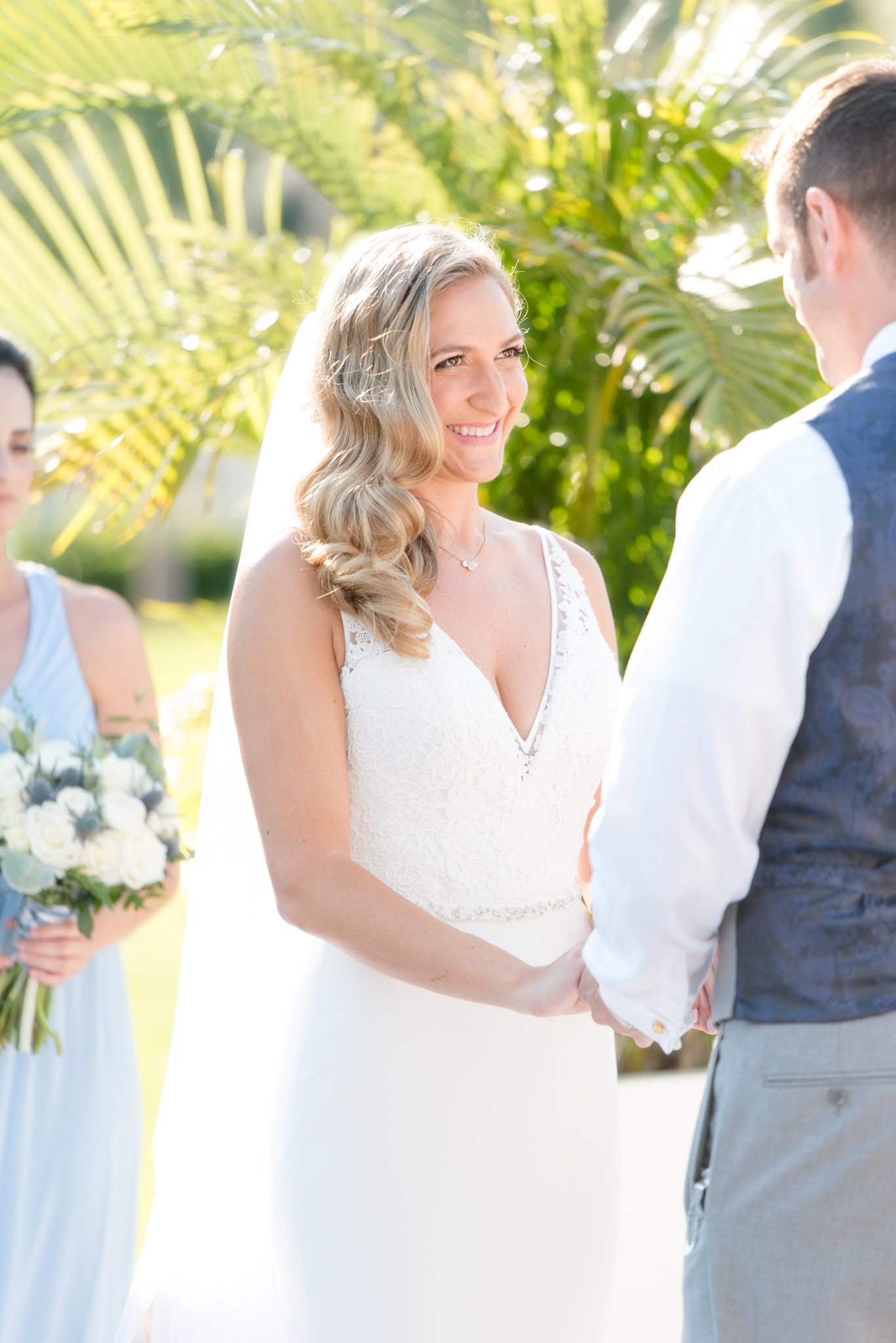 Bride smiles during wedding ceremony.