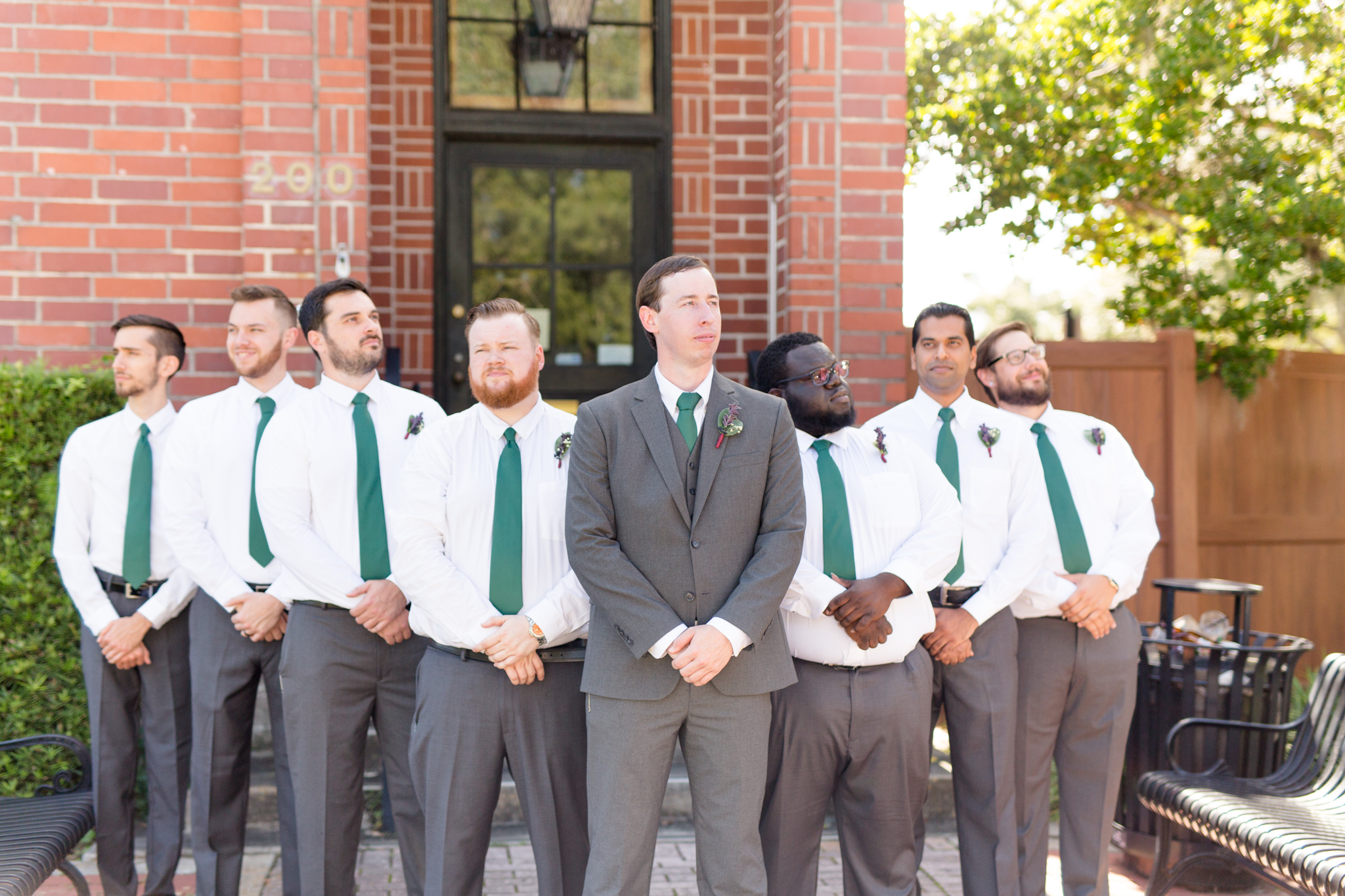 Groom and groomsmen stand together.