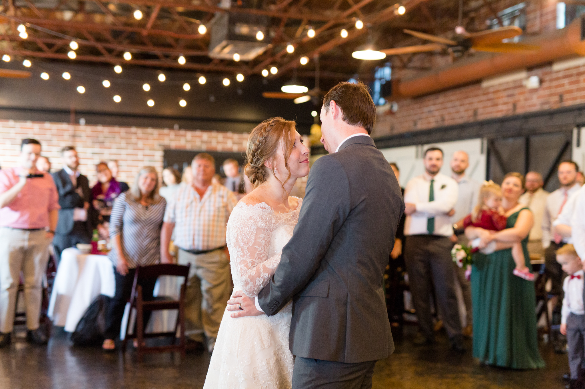 Bride and groom dance at reception.