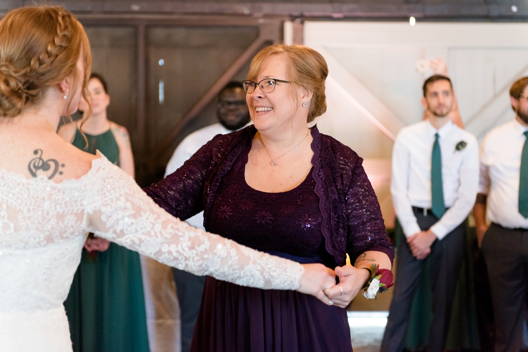 Mother of bride and bride dance at reception.