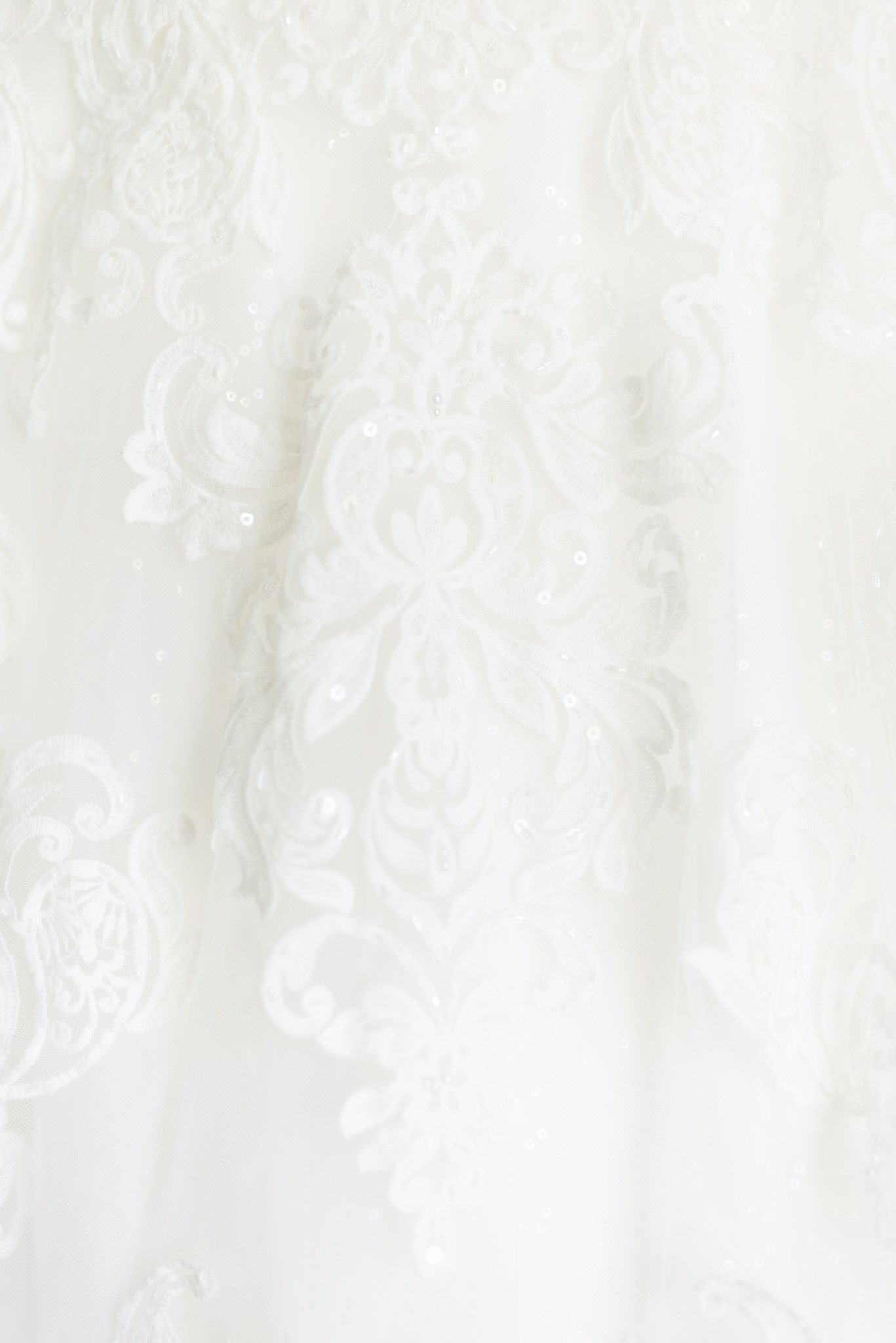 Lace pattern on wedding dress.