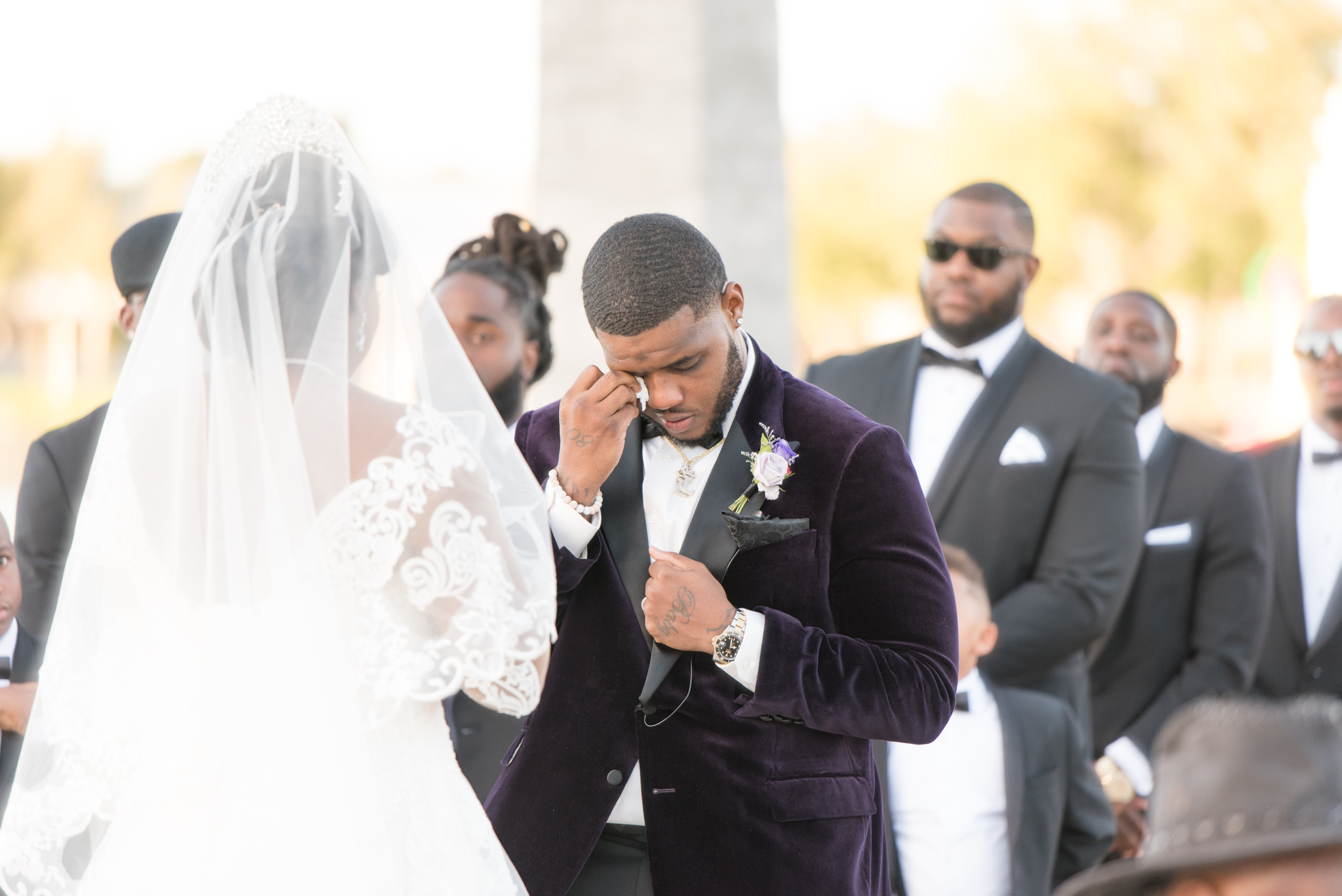 Groom cries during wedding ceremony.