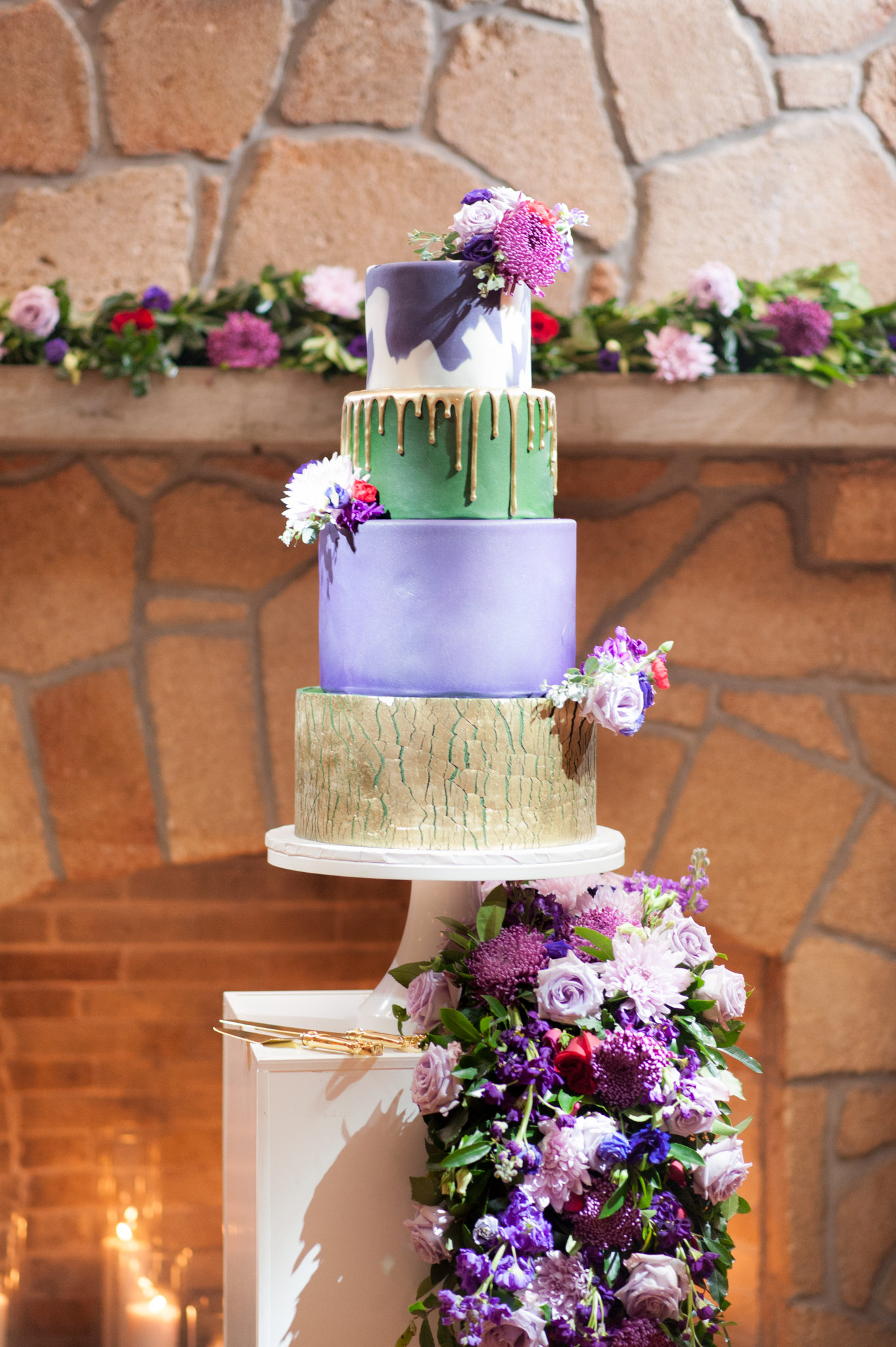 Gold, purple, and green wedding cake.