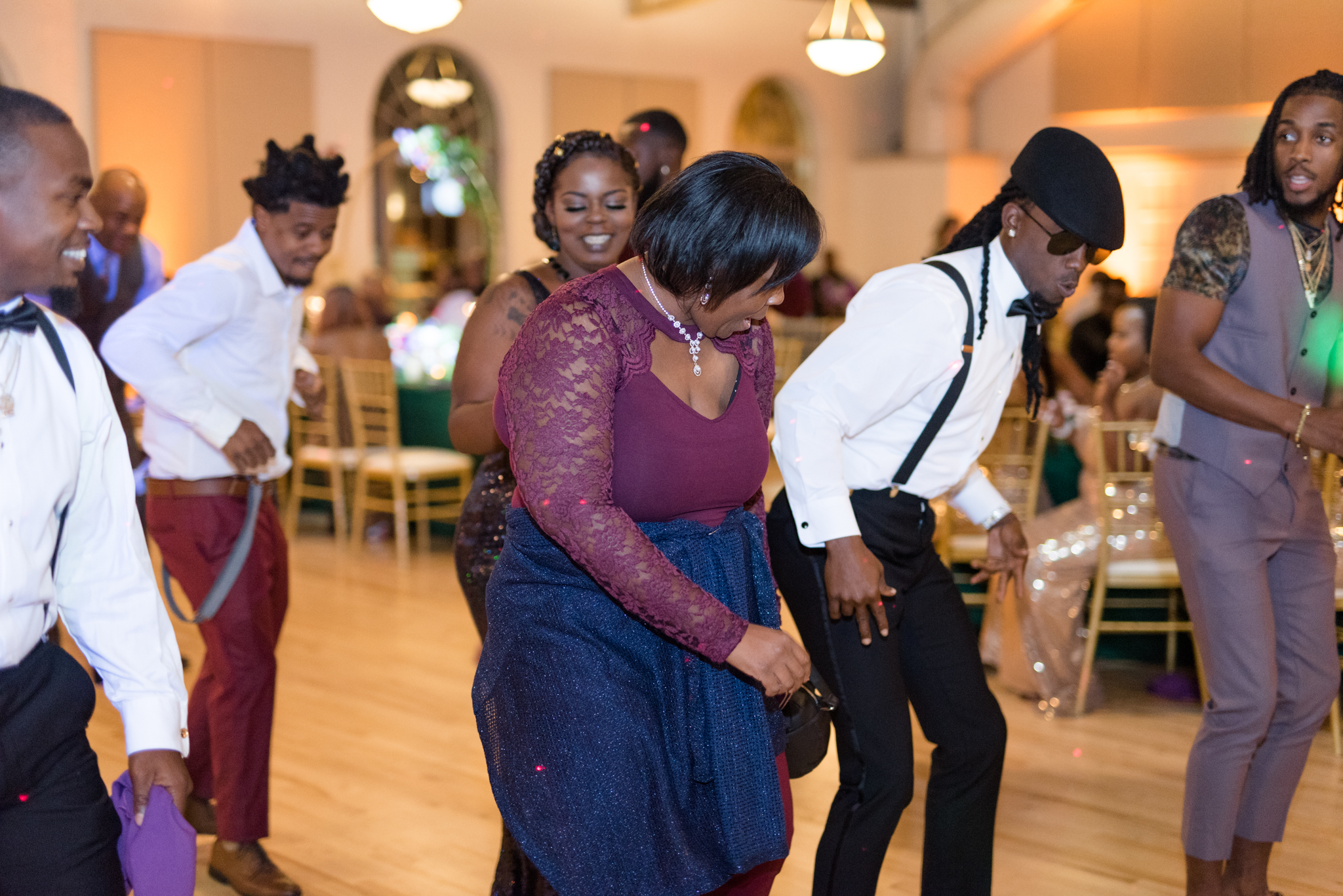 Guests dance at wedding reception.