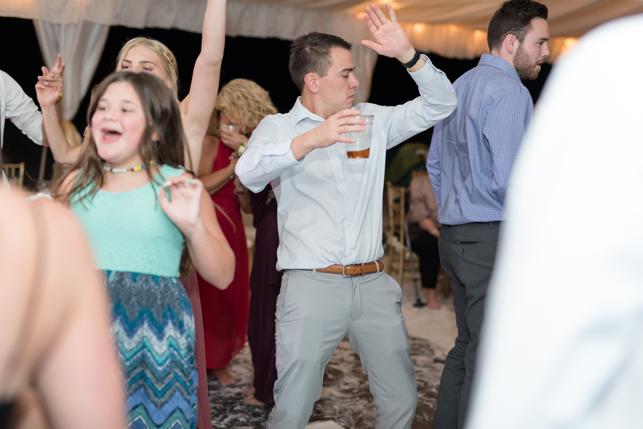 Guest dances at wedding reception.