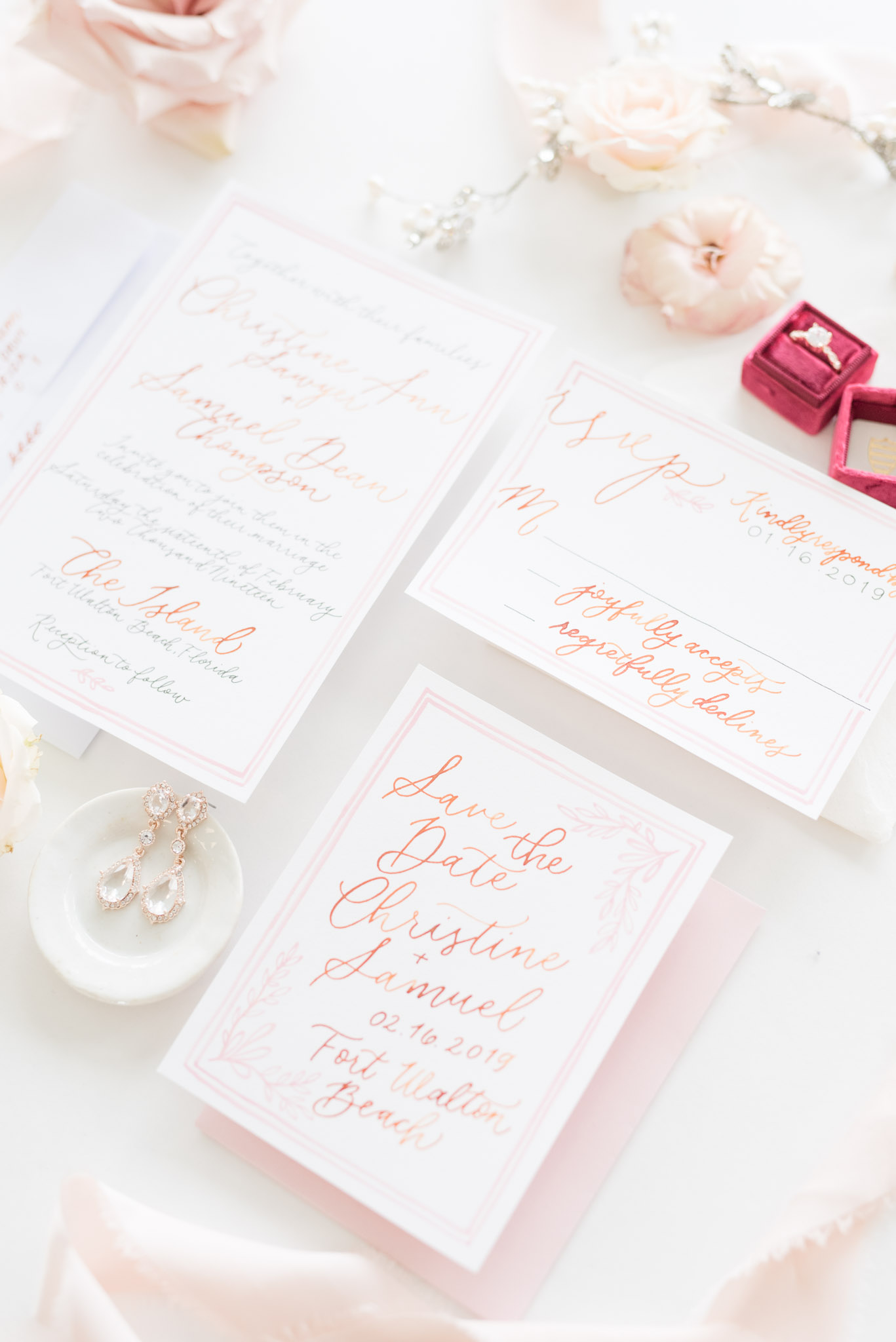 White and blush wedding invitation.
