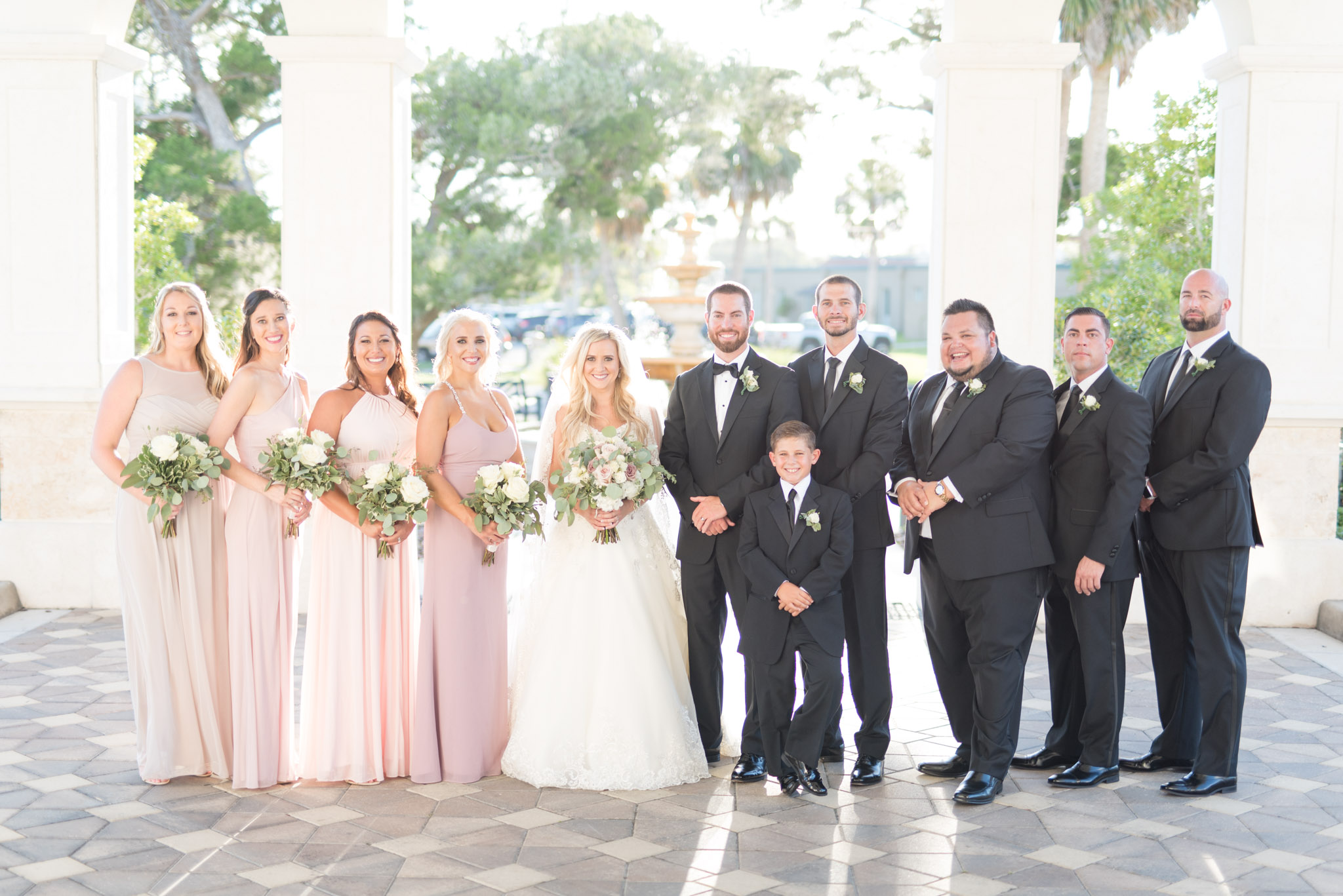 Wedding party smile at camera.