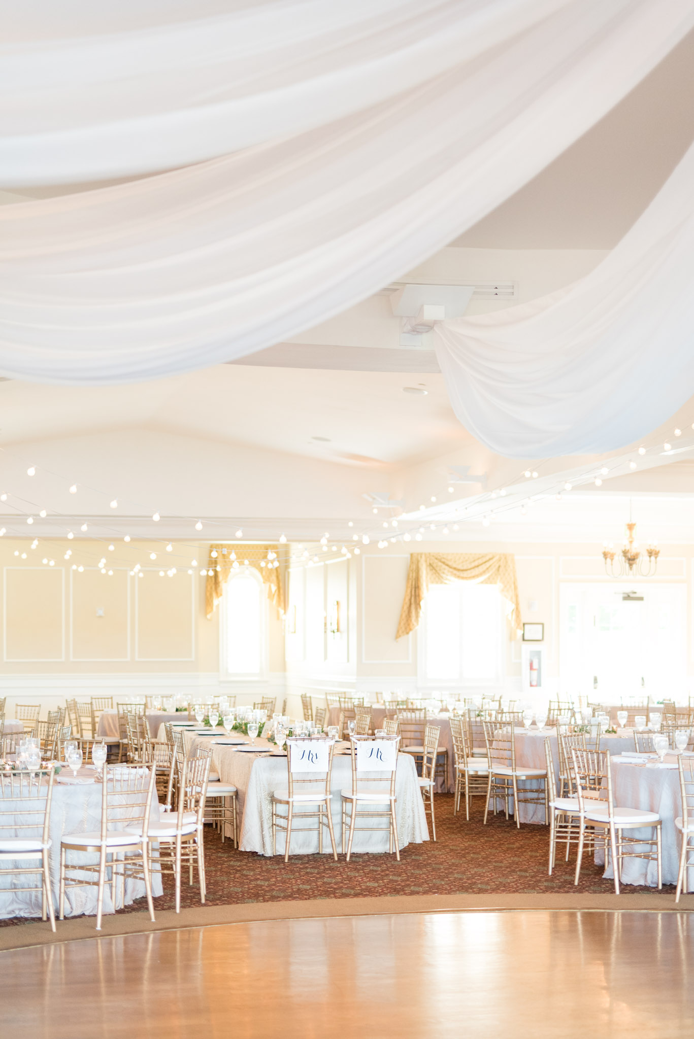 White and gold reception at wedding.