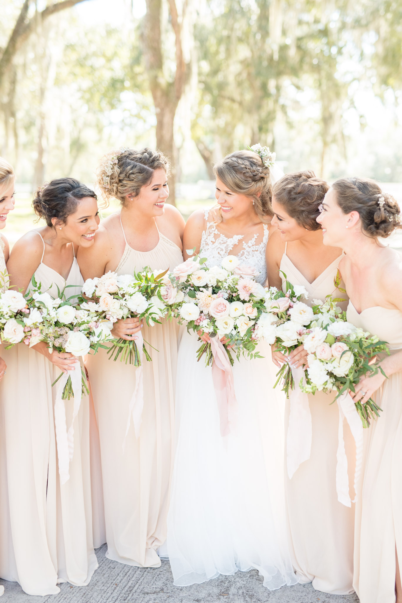 Bridal party giggles together.