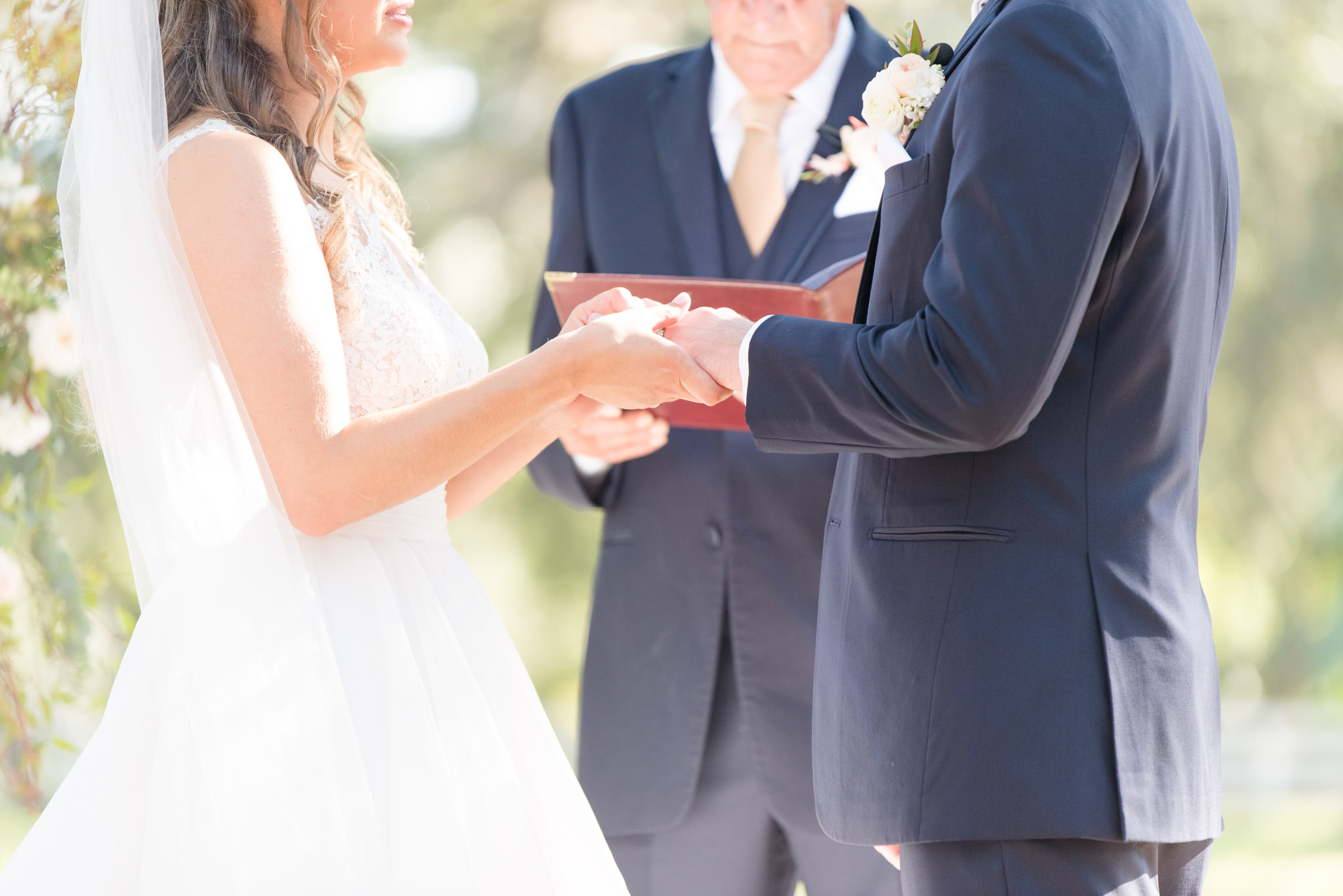 Bride and groom exchange rings.