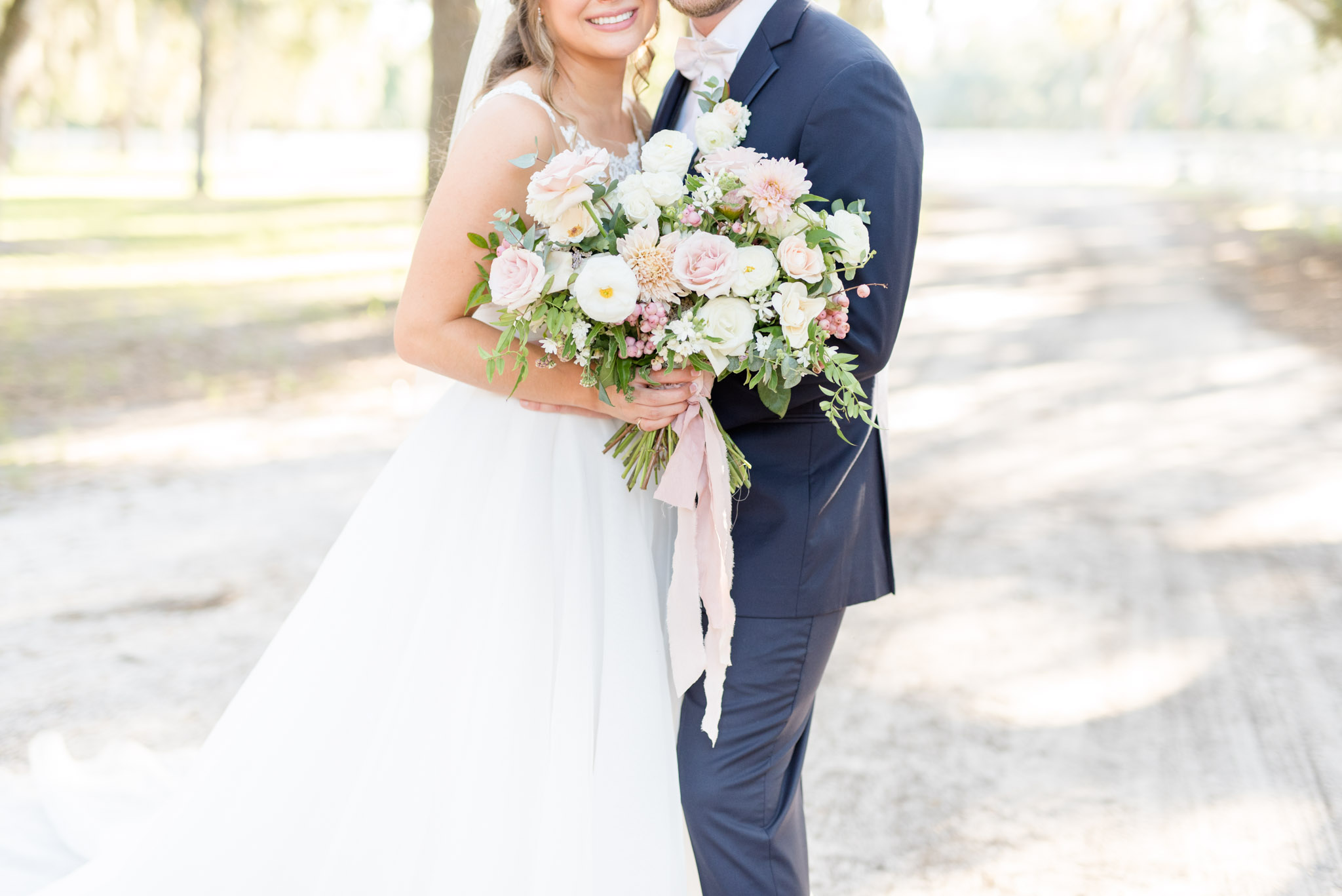 Wedding flowers with pink ribbon.