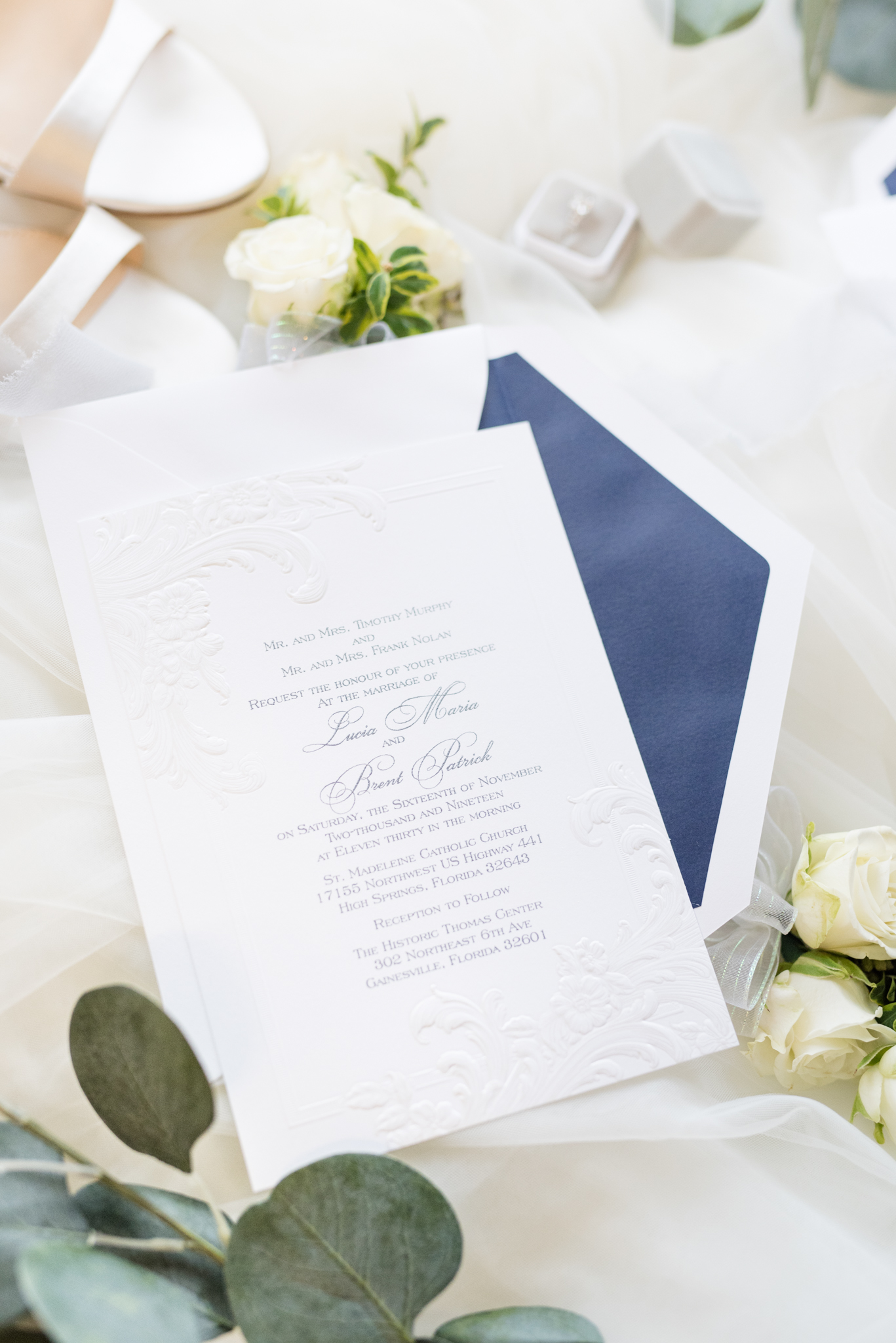 Wedding invitations with bridal details.