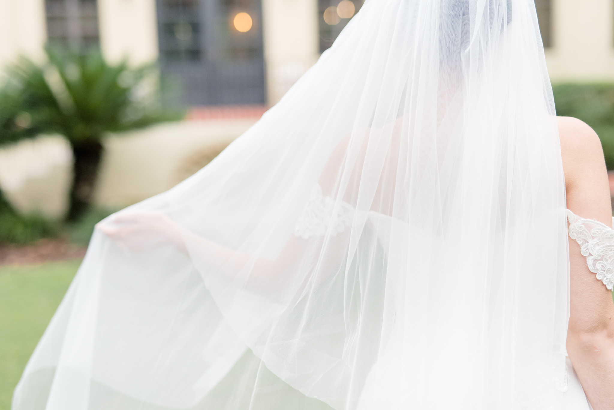 Bride touches veil.