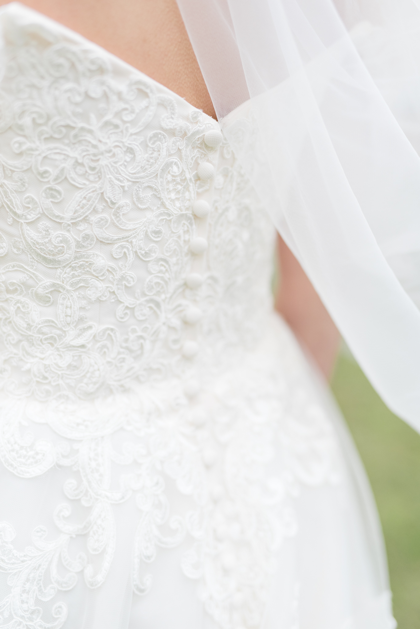 Lace and buttons on wedding gown.