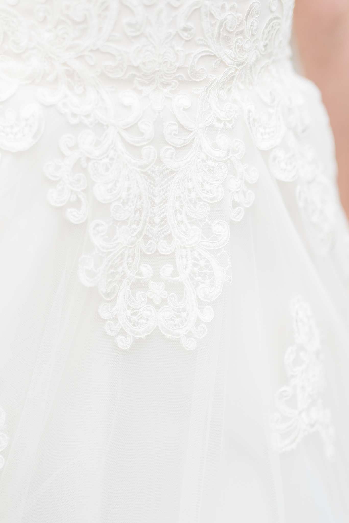 Lace on wedding dress.
