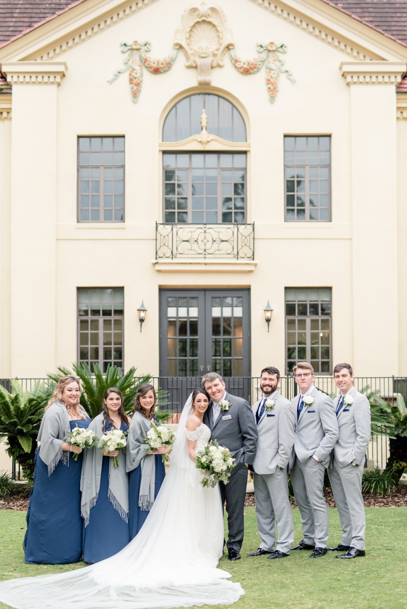 Wedding party smiles at camera.