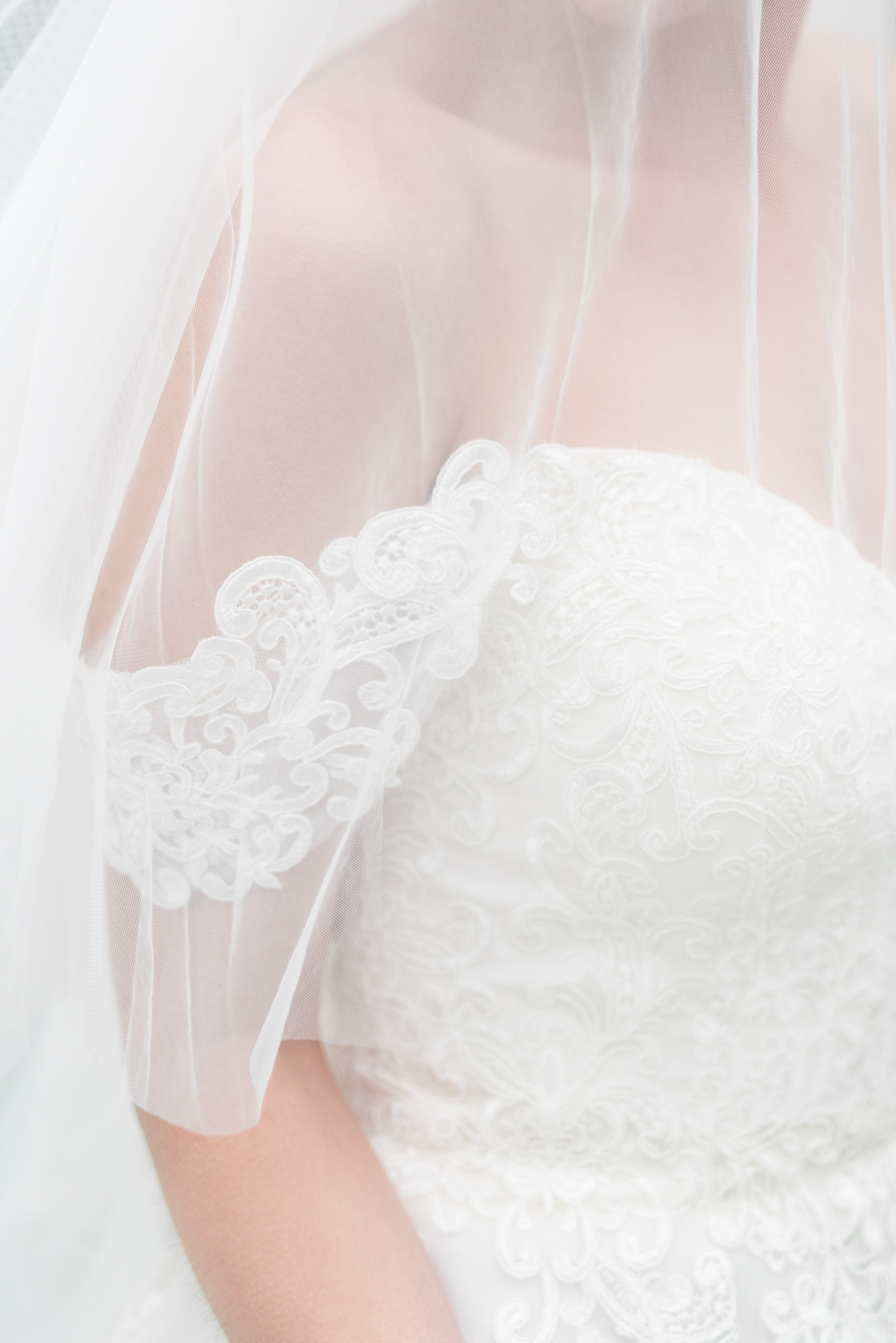 Lace details on wedding gown sleeve.