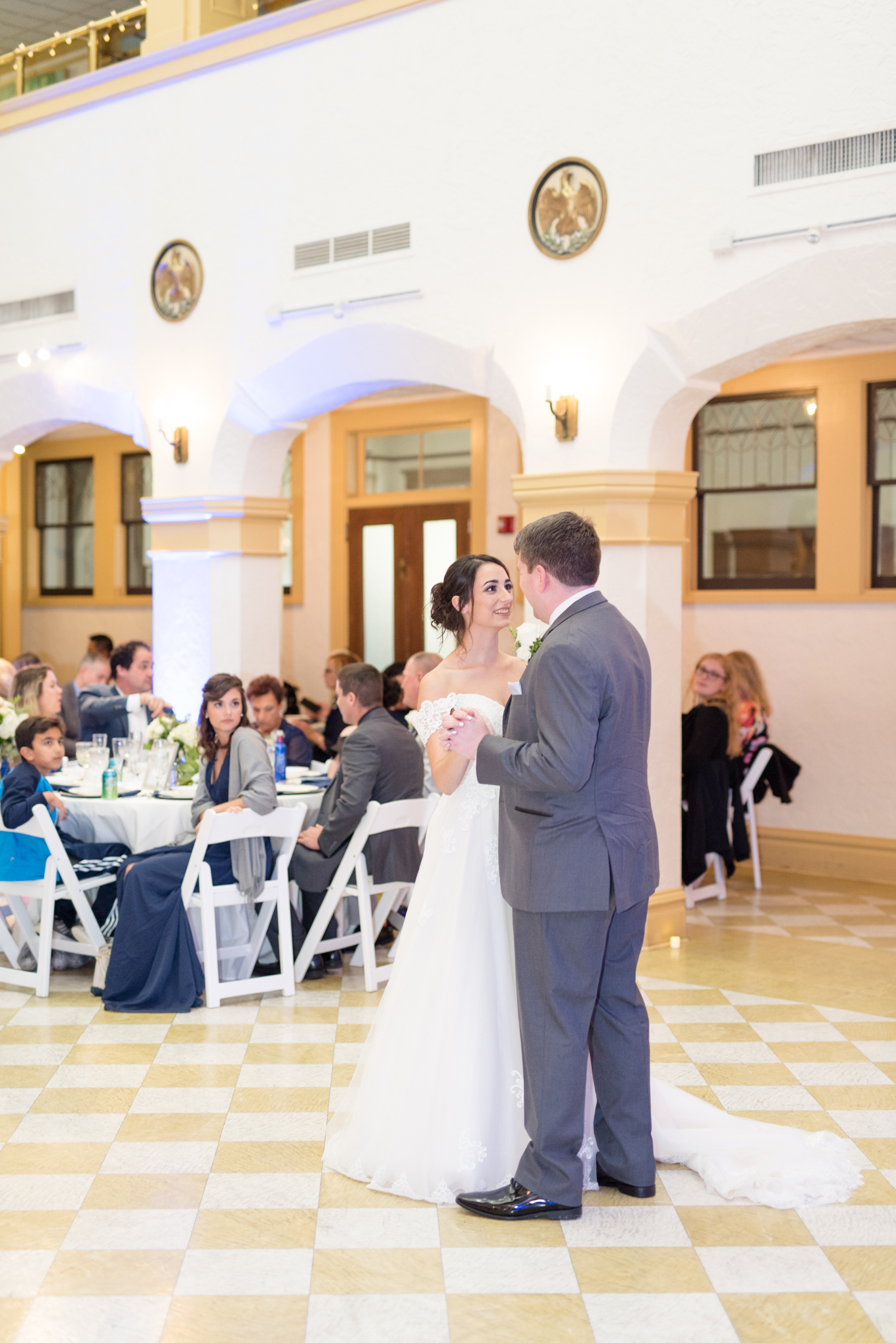 Bride and groom dance at wedding reception.