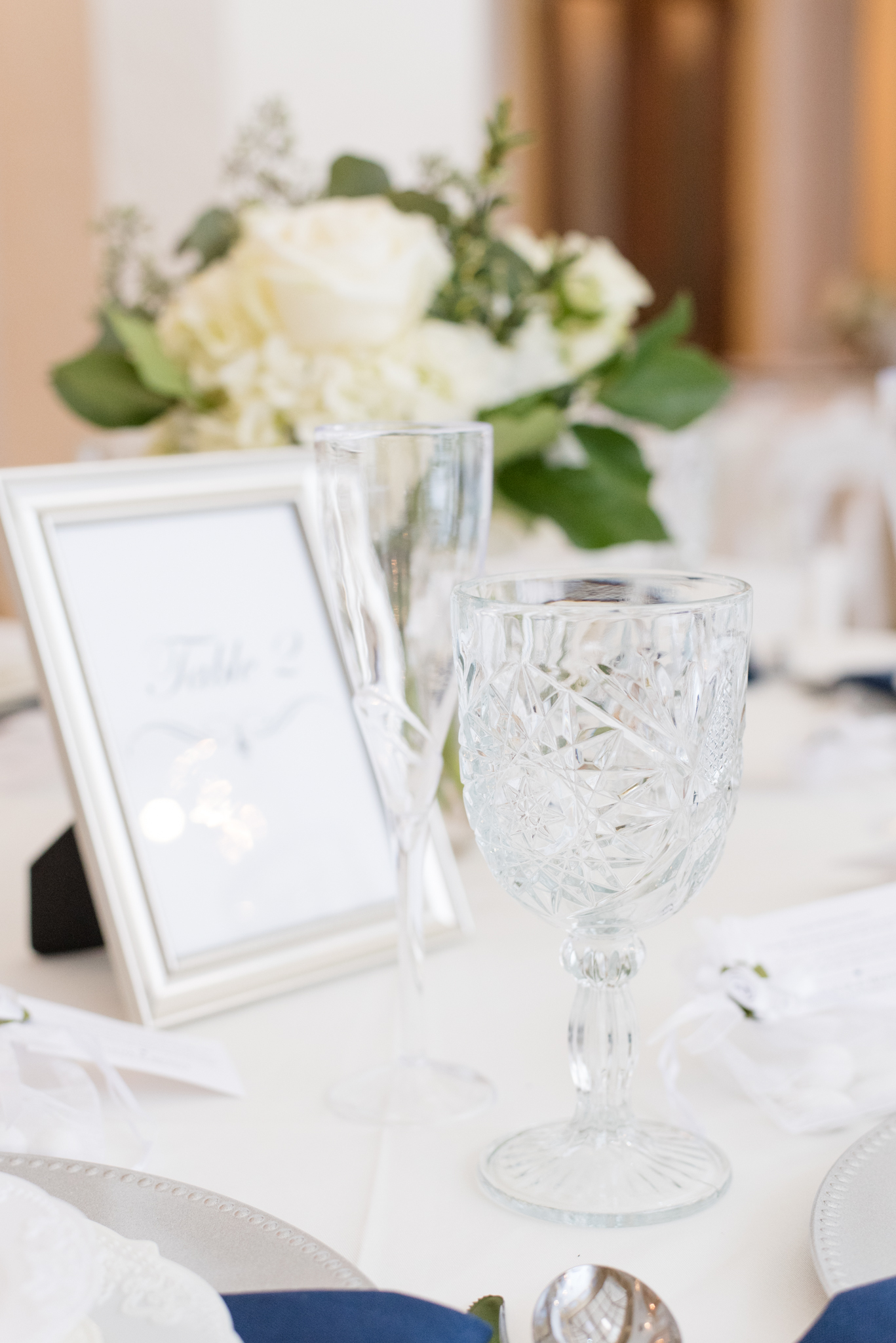 Glasses on wedding reception table.