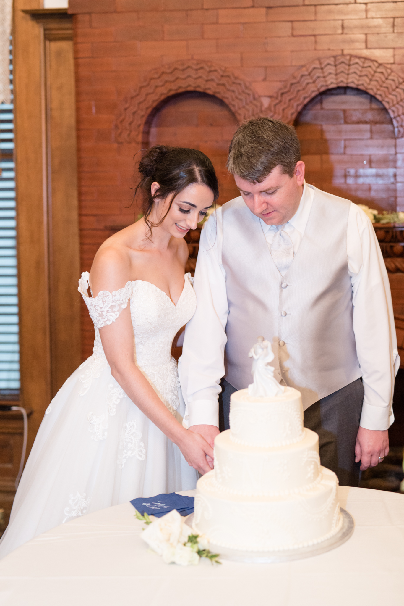 Bride and groom cut the cake.