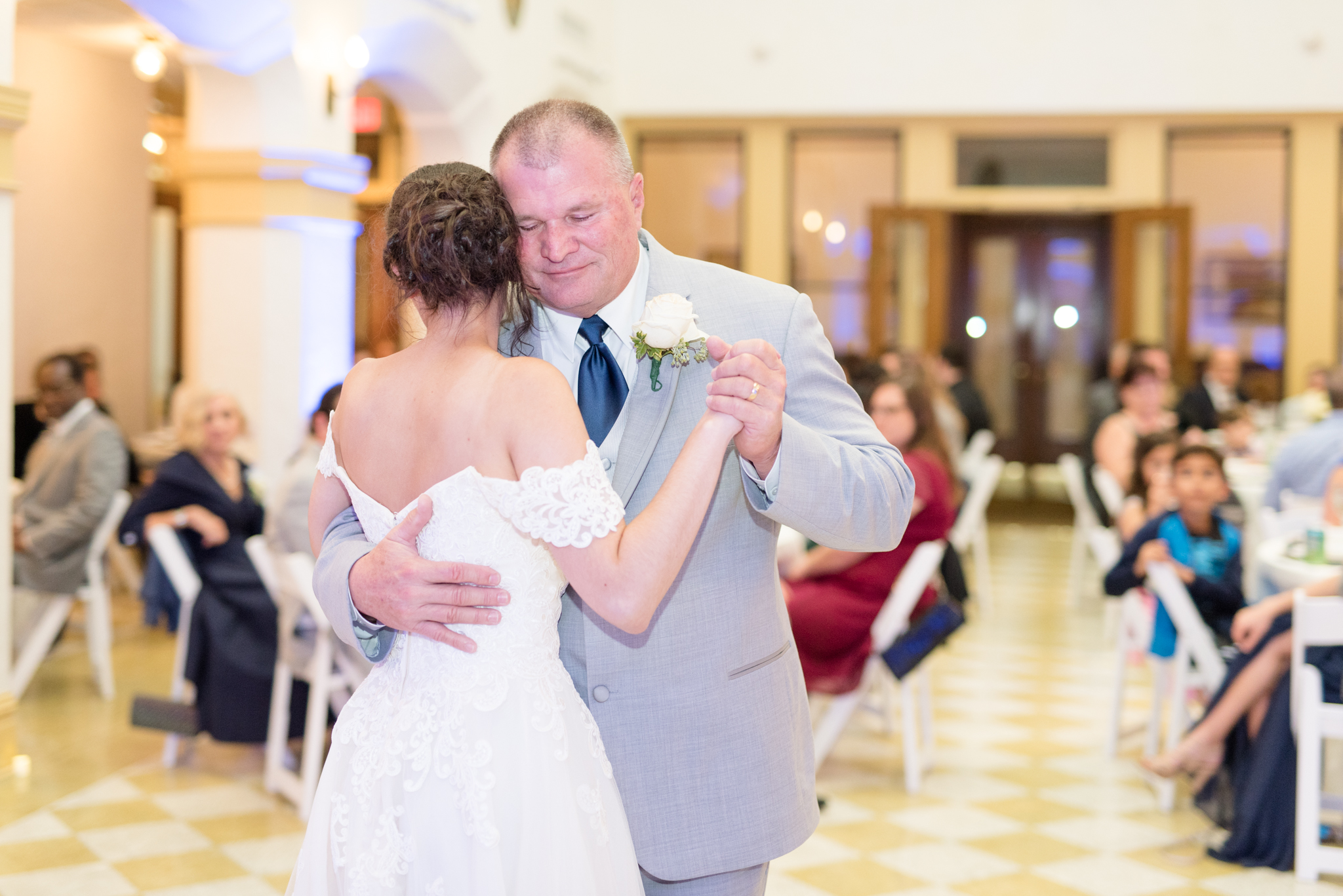 Bride and her dad dance during reception.