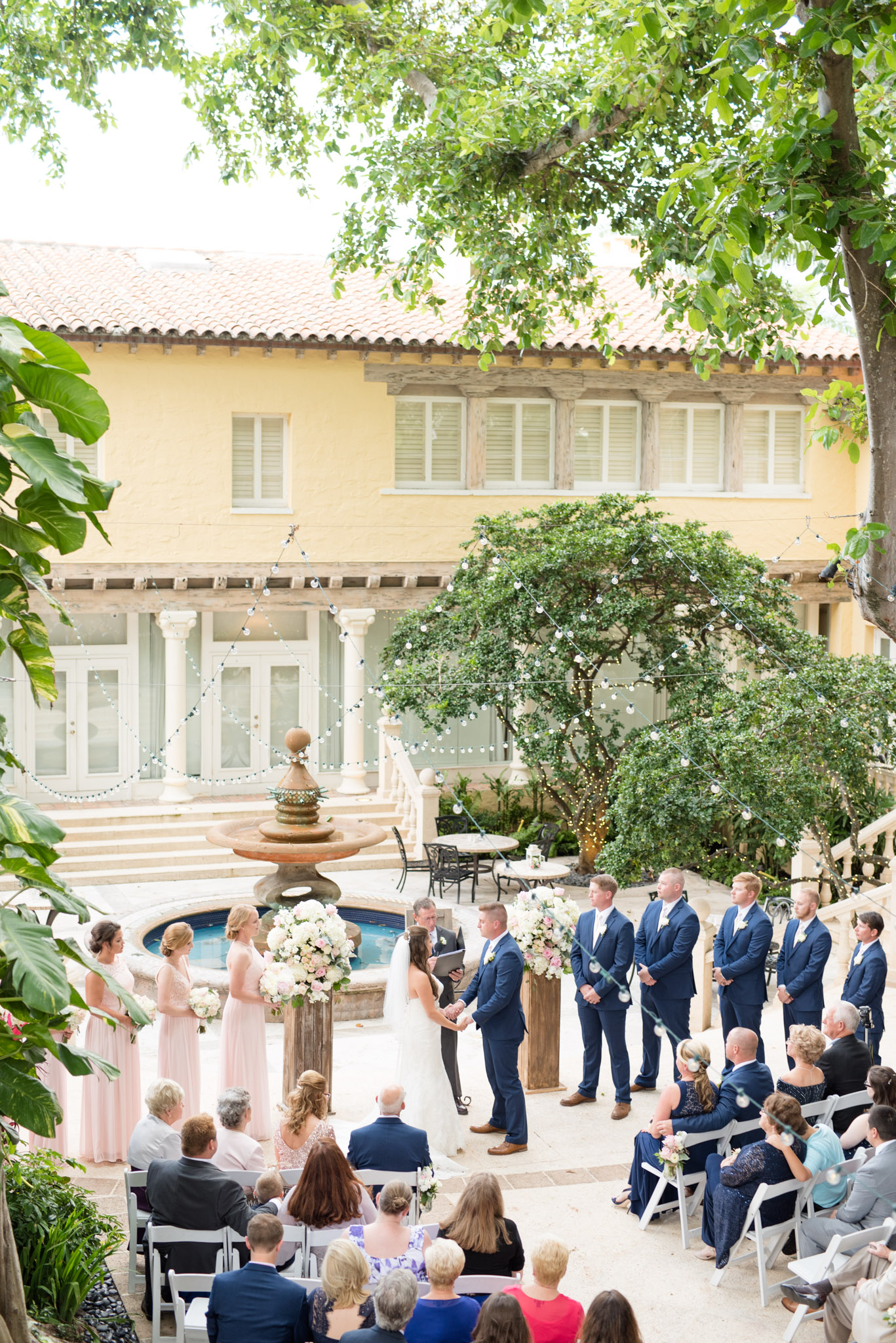 Wedding ceremony in a garden courtyard.