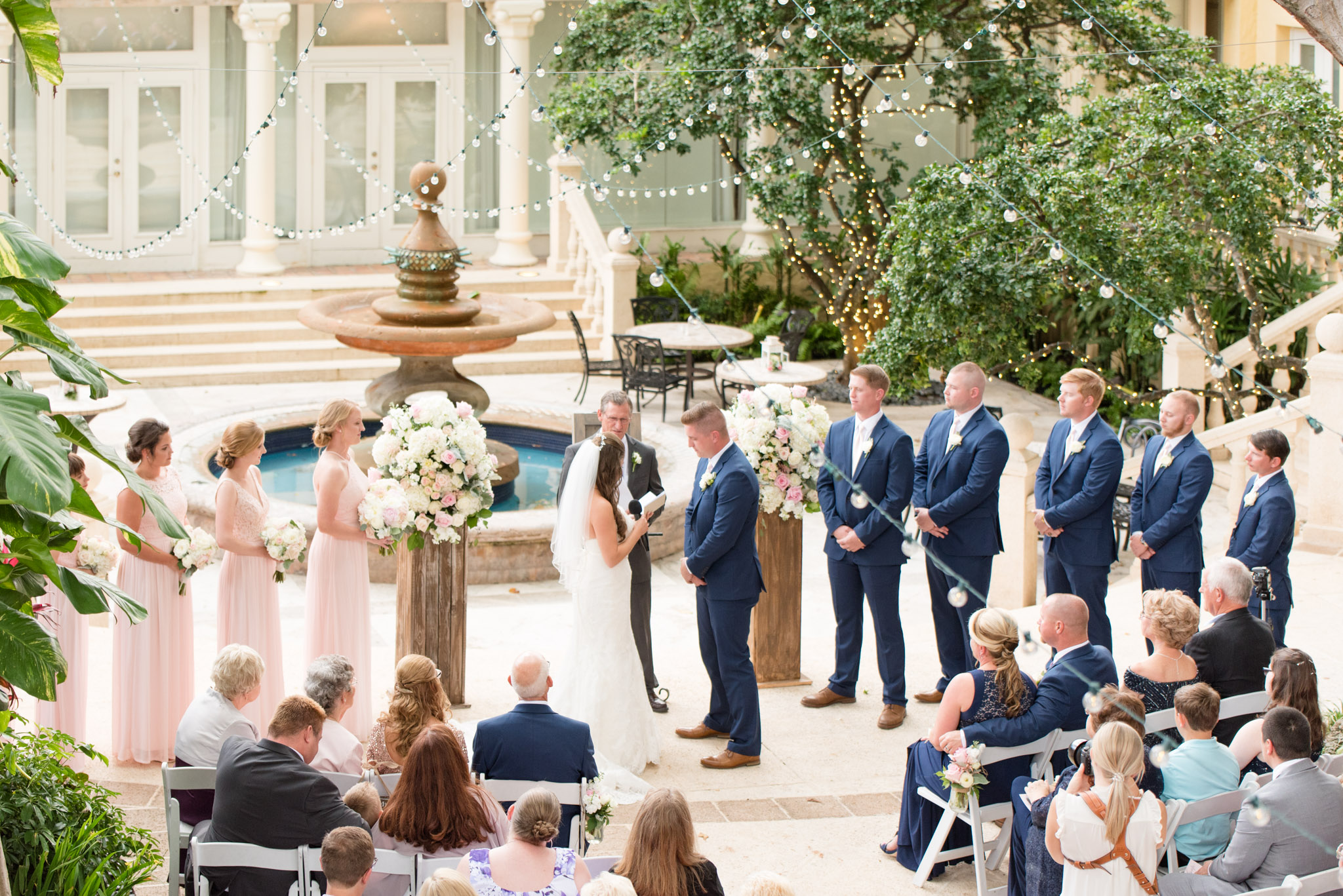 Bride reads vows to groom.